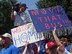 BEAVERCREEK, Ohio -- Armed with homemade signs, members of the crowd wait for the Terpenning family to arrive home August 6 and see their new house for the first time.   (Air Force photo by Ron Fry)
