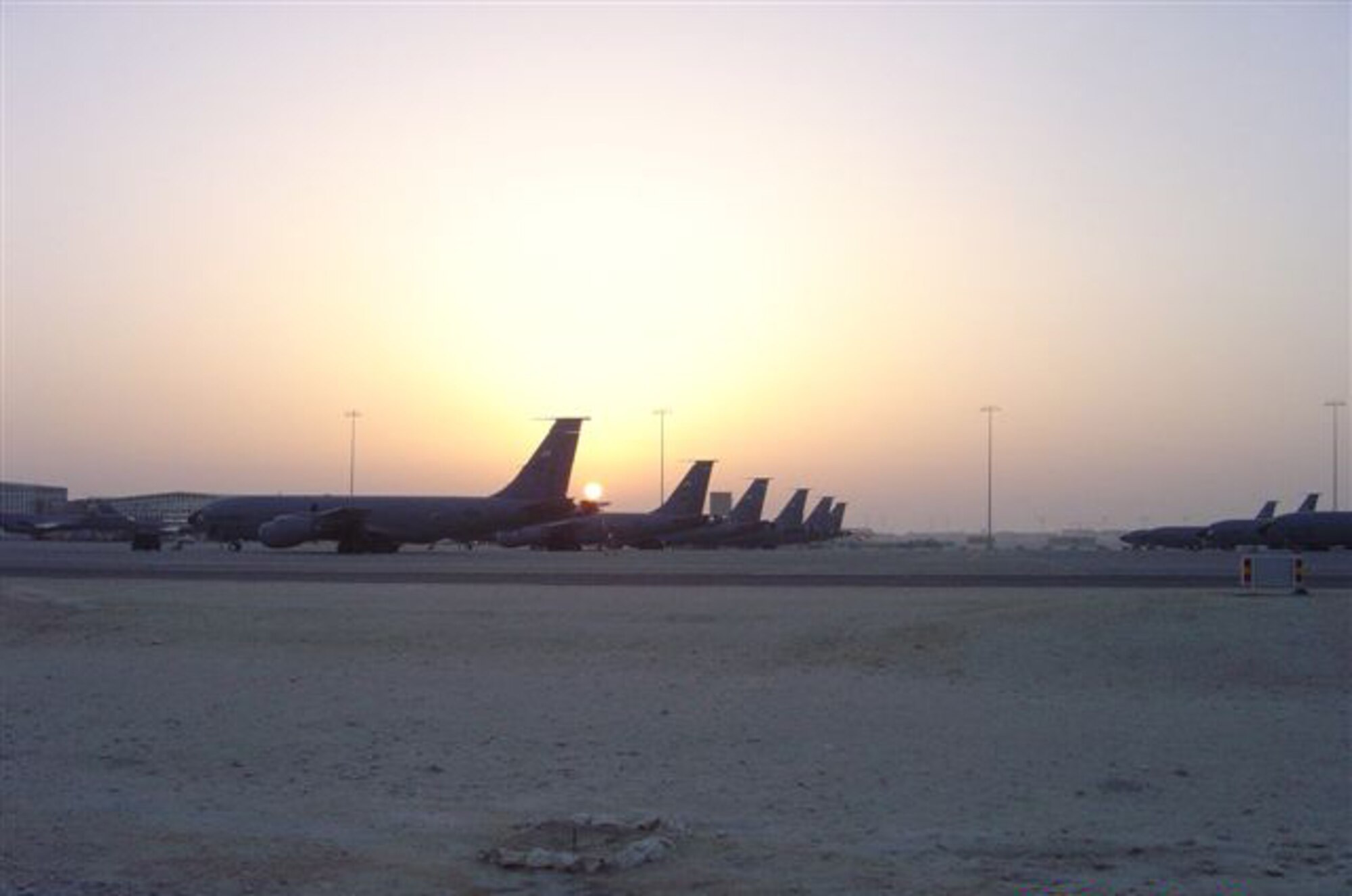 A low desert sun casts a warm glow on KC-135 Stratotankers deployed to Southwest Asia. The scene was captured by Master Sgt. Bob Lorenz during his recent deployment with other Airmen assigned to the 931st Air Refueling Group, a Reserve unit at McConnell Air Force Base, Kan. More than 10 percent of the Airmen in the 931st ARG are currently deployed in support of overseas contingencies. About half of them are from Sergeant's Lorenz's unit, the 931st Aircraft Maintenance Squadron. (Courtesy photo/Master Sgt. Bob Lorenz)                                