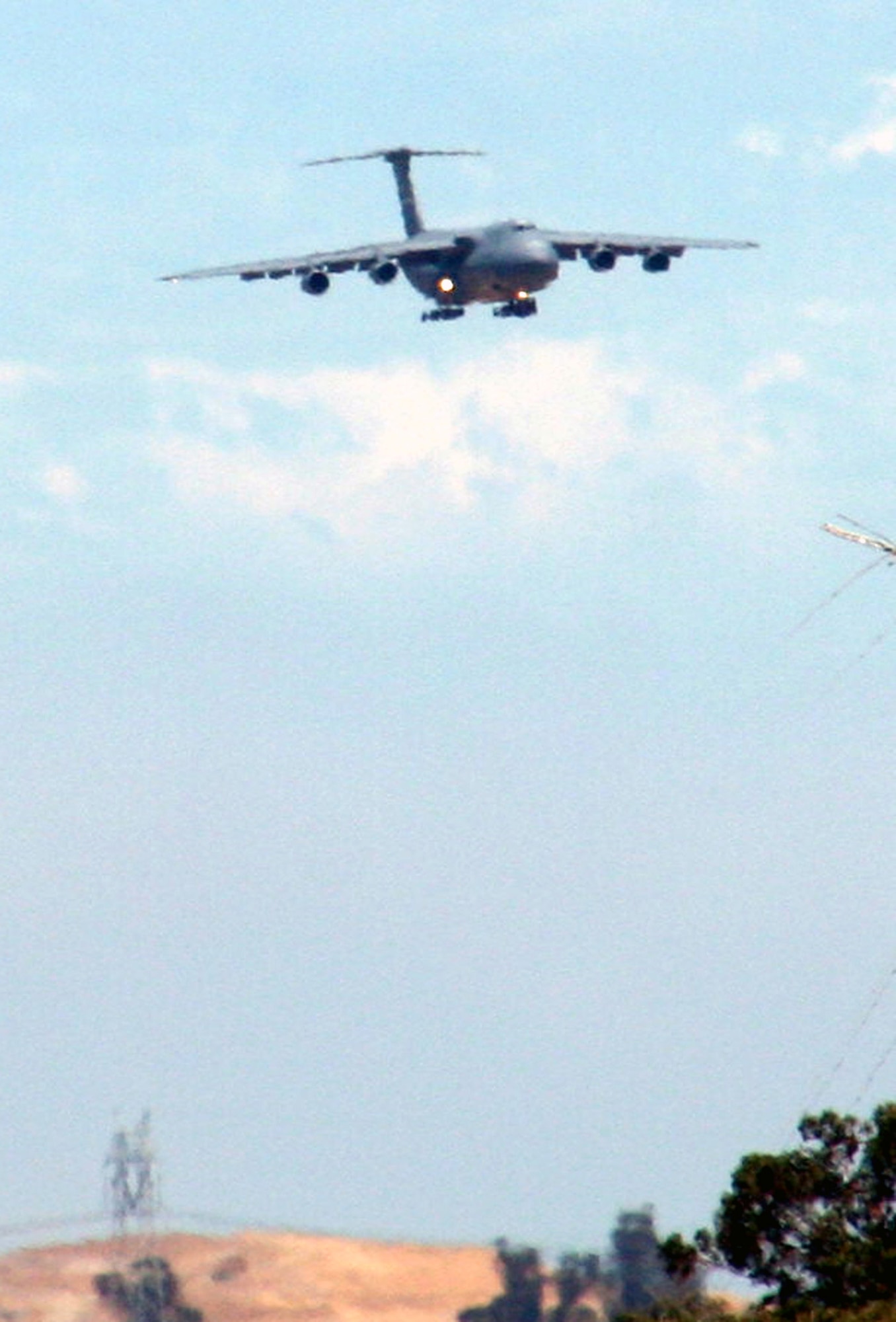 A C-5 Galaxy from the 60th Air Mobility Wing comes in for a landing at Travis Air Force Base, Calif., on Aug. 5, 2009. The C-5 is Air Mobility Command's and the Air Force's largest airlift plane.  The C-5 can carry more than any other airlifter. It has the ability to carry 36 standard pallets and up to 81 troops simultaneously. (U.S. Air Force Photo/Tech. Sgt. Scott T. Sturkol)