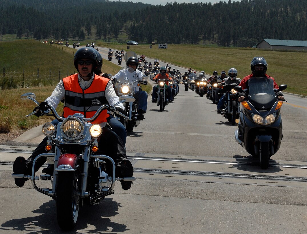 Motorcycle riders participating in the Ninth Annual Dakota Thunder Motorcycle Run drive outside of Sturgis, S.D., August 4. More than 400 riders participated in the 57-mile ride from Ellsworth Air Force Base to Sturgis. (U.S. Air Force photo/Airman 1st Class Joshua J. Seybert)