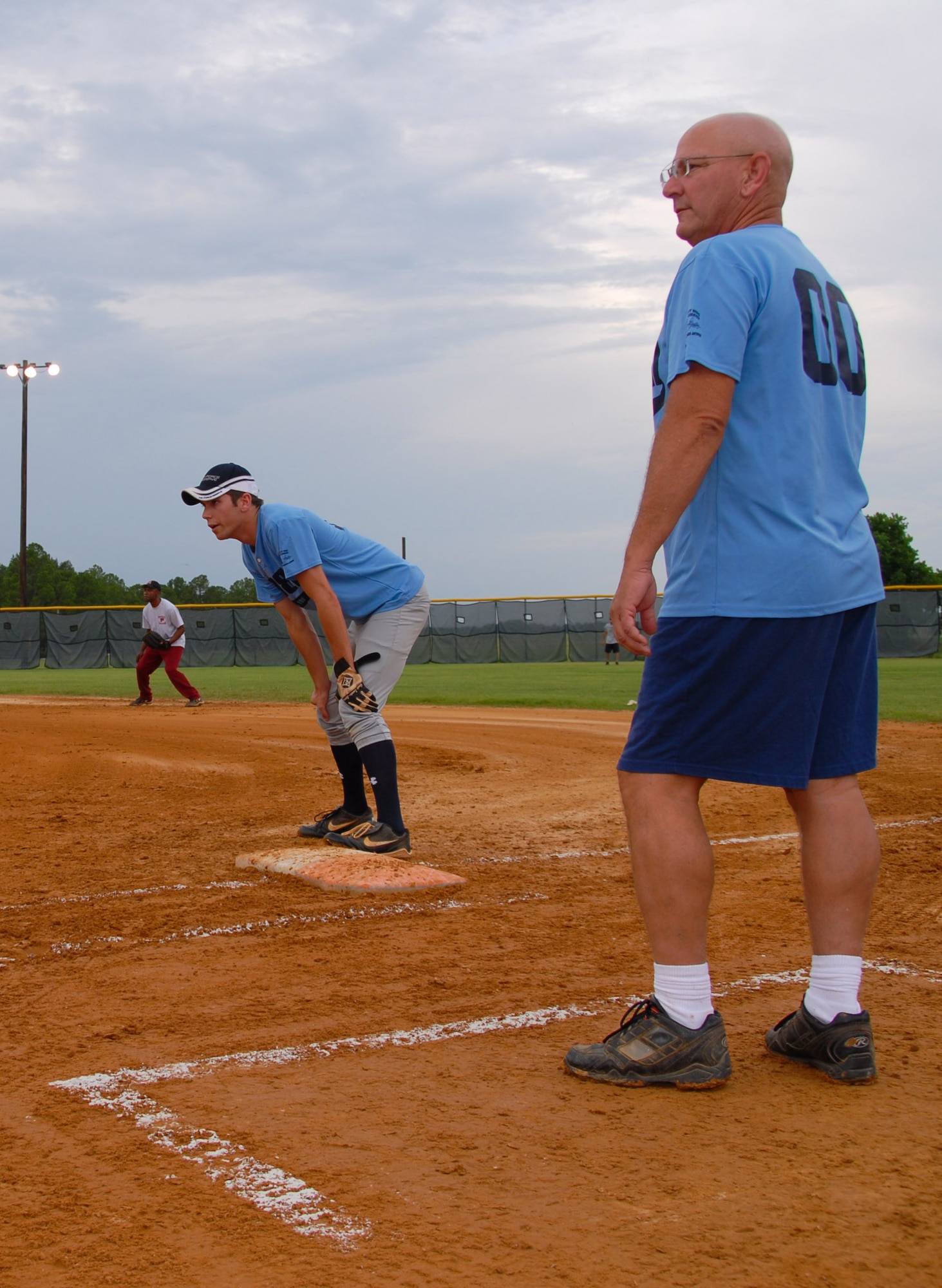 The 908th Airlift Wing softball team's Assistant Coach Senior Master Sgt. Mark Williams ponders the outcome of the game. The 908th won the Maxwell-Gunter intramural softball championship game July 30 against the Electronic Systems Group team. (U.S. Air Force photo/Jamie Pitcher)