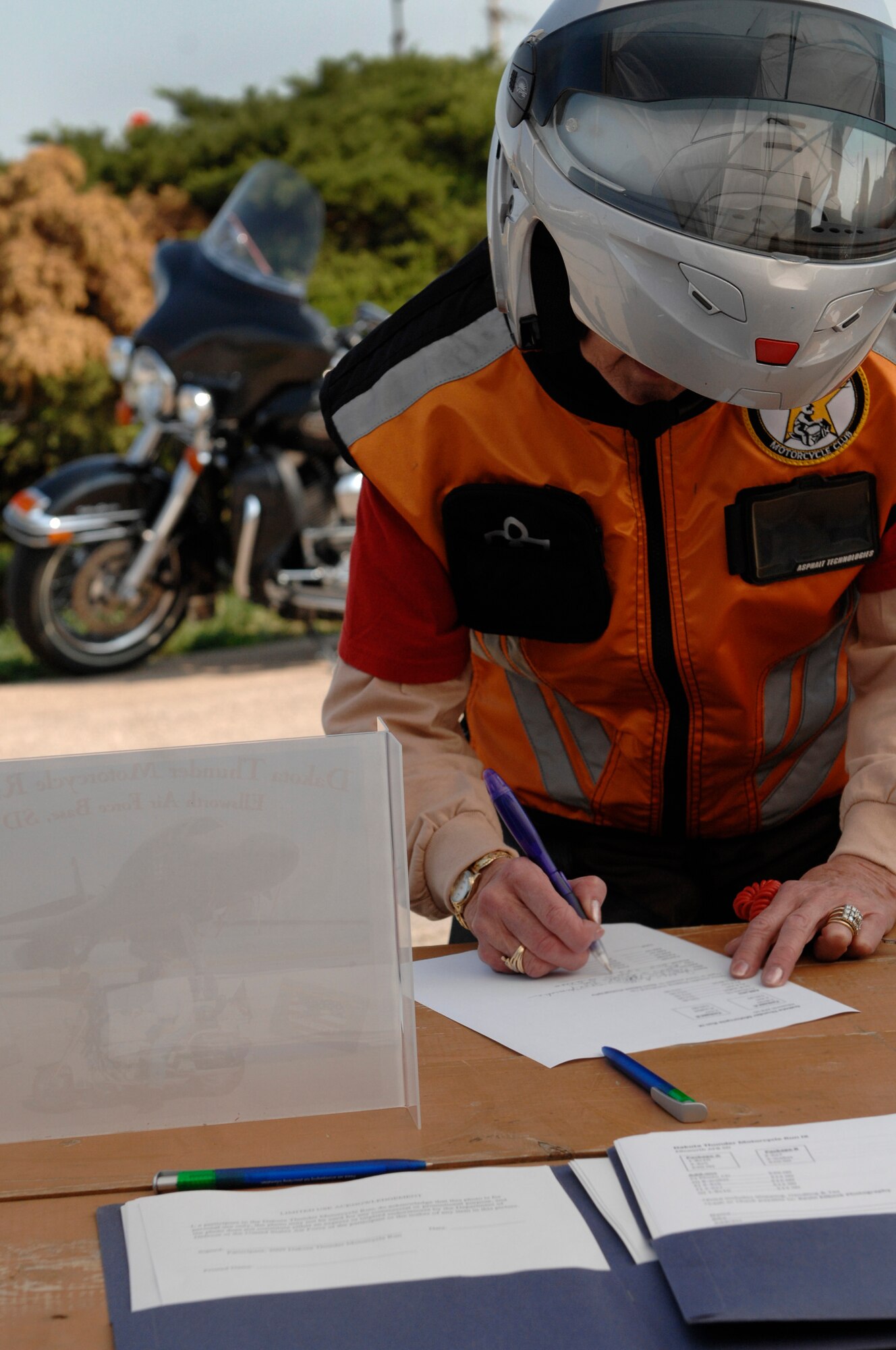 Ms. Judith Button registers her motorcycle in Box Elder, S.D., for the Ninth Annual Dakota Thunder Motorcycle Run, August 4. The 57-mile ride from Ellsworth Air Force Base to Sturgis, S.D., was a way for the Dakota Thunder Motorcycle Club to pay tribute to veterans. (U.S. Air Force photo/Airman 1st Class Joshua J. Seybert)