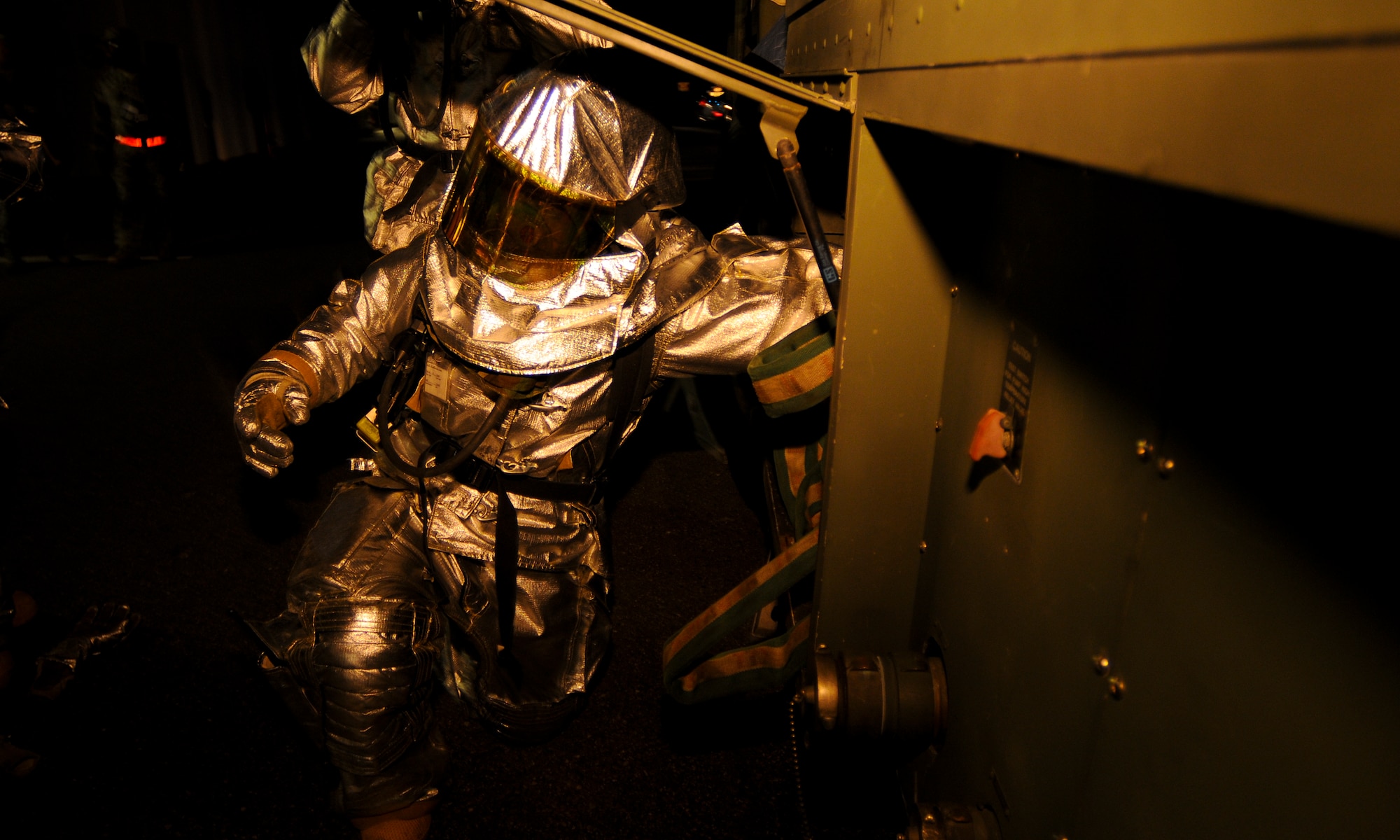 SPANGDAHLEM AIR BASE, Germany -- Firefighters from the 52nd Civil Engineer Squadron roll a fire hose after containing a simulated building fire at the 81st Fighter Squadron. The simulation was part of the 52nd Fighter Wing’s Phase II exercise to prepare for a NATO Tactical Evaluation in June 2010. (U.S. Air Force photo/Airman 1st Class Nathanael Callon)