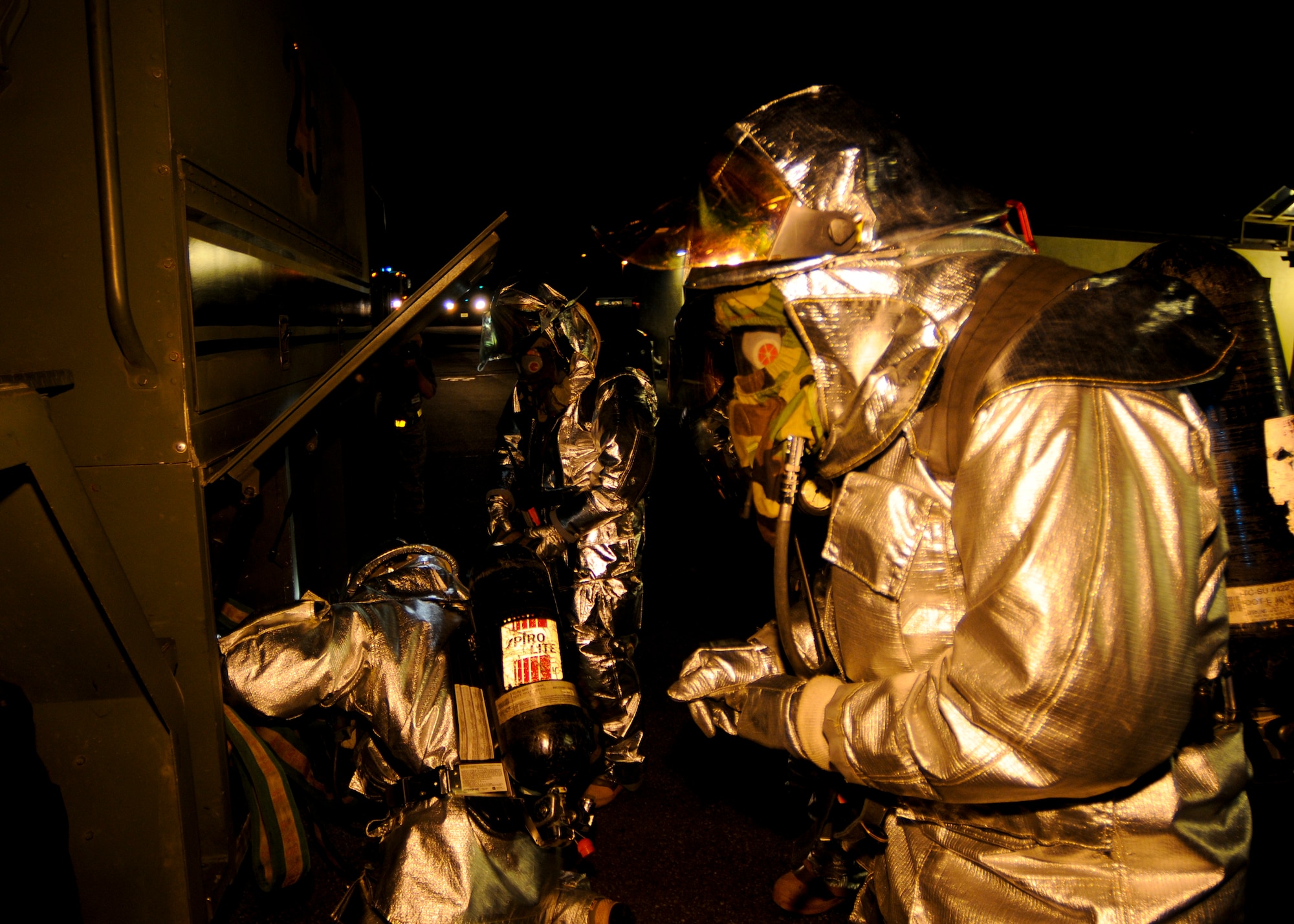 SPANGDAHLEM AIR BASE, Germany -- Firefighters from the 52nd Civil Engineer Squadron roll a fire hose after containing a simulated building fire at the 81st Fighter Squadron. The simulation was part of the 52nd Fighter Wing’s Phase II exercise to prepare for a NATO Tactical Evaluation in June 2010. (U.S. Air Force photo/Airman 1st Class Nathanael Callon)