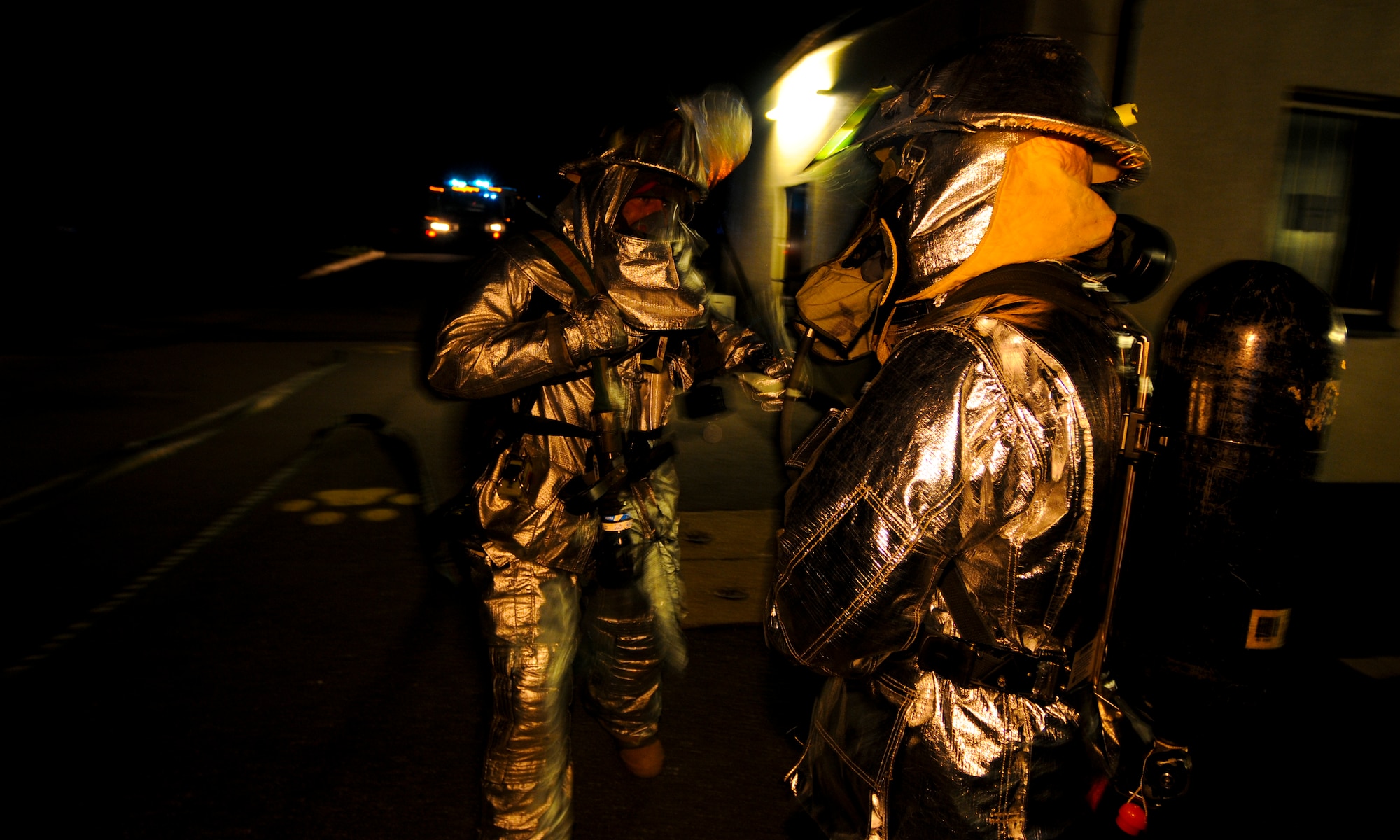 SPANGDAHLEM AIR BASE, Germany -- Firefighters from the 52nd Civil Engineer Squadron prepare to enter a simulated building fire at the 81st Fighter Squadron Aug. 5. The simulation was part of the 52nd Fighter Wing’s Phase II exercise to prepare for a NATO Tactical Evaluation in June 2010. (U.S. Air Force photo/Airman 1st Class Nathanael Callon)