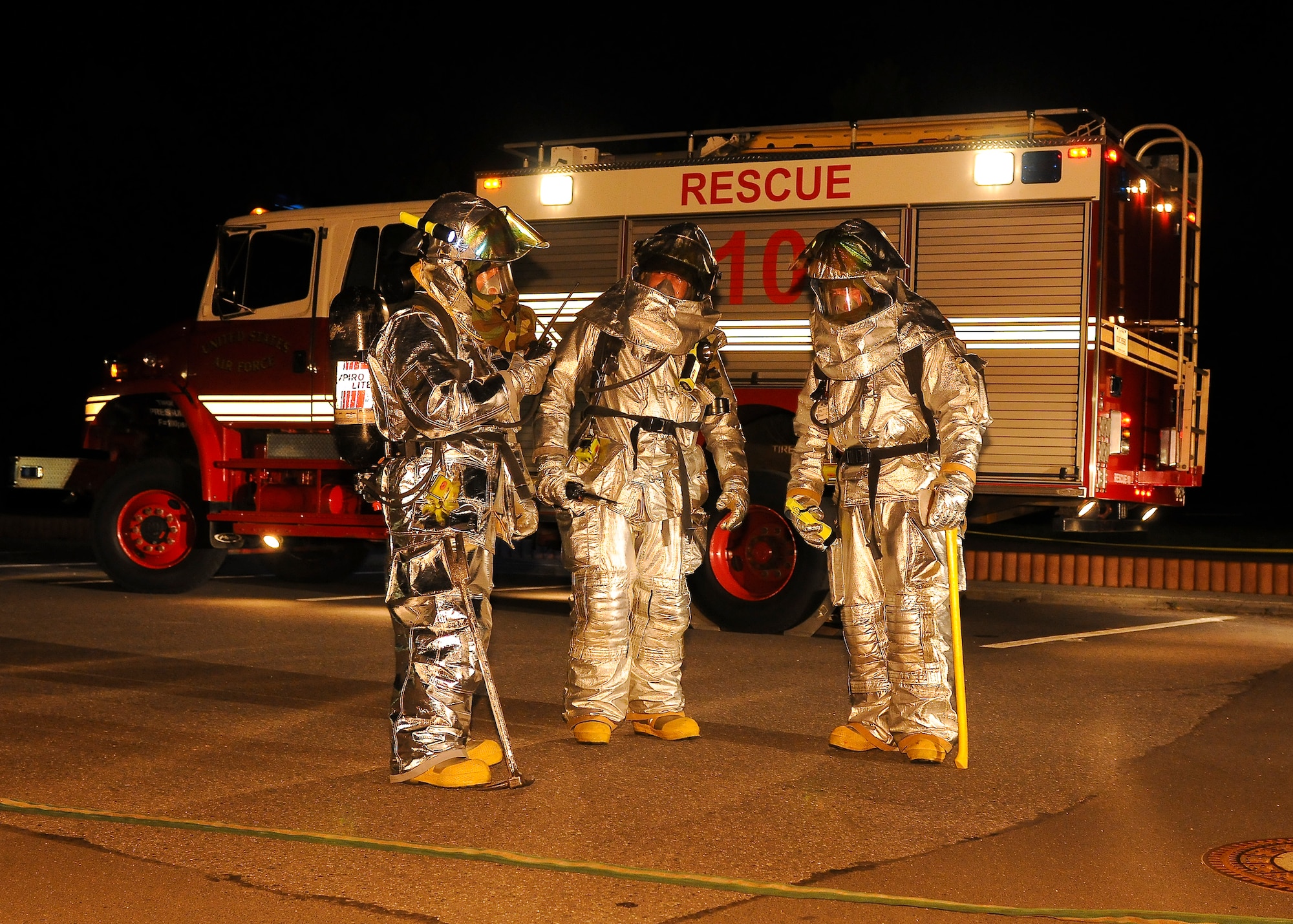SPANGDAHLEM AIR BASE, Germany -- Firefighters from the 52nd Civil Engineer Squadron discuss the best method to fight a simulated building fire at the 81st Fighter Squadron Aug. 5. The simulation was part of the 52nd Fighter Wing’s Phase II exercise to prepare for a NATO Tactical Evaluation in June 2010. (U.S. Air Force photo/Airman 1st Class Nathanael Callon)