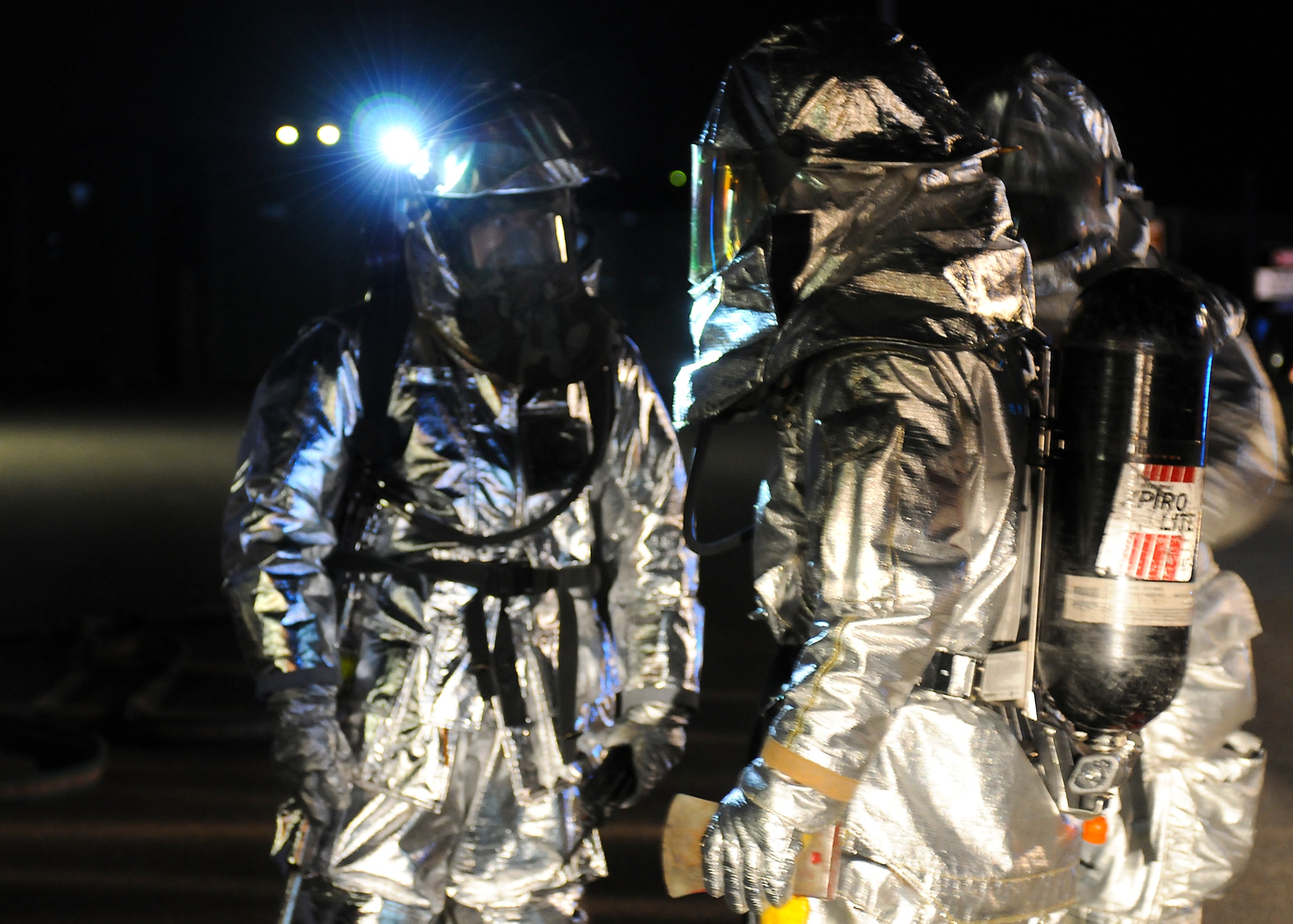 SPANGDAHLEM AIR BASE, Germany -- Firefighters from the 52nd Civil Engineer Squadron discuss the best method to fight a simulated building fire at the 81st Fighter Squadron Aug. 5. The simulation was part of the 52nd Fighter Wing’s Phase II exercise to prepare for a NATO Tactical Evaluation in June 2010. (U.S. Air Force photo/Airman 1st Class Nathanael Callon)