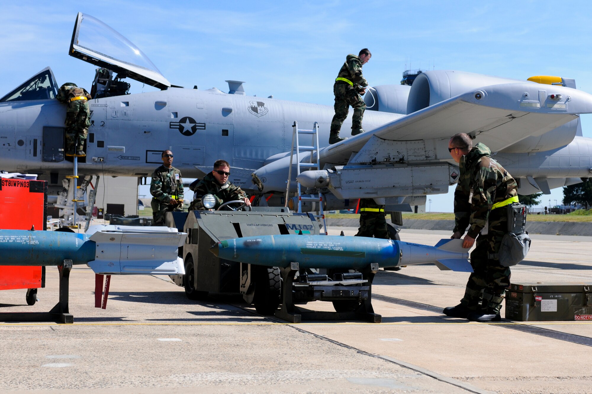 SPANGDAHLEM AIR BASE, Germany -- Members of the 81st Aircraft Maintenance Unit prepare an A-10 Thunderbolt II for a mission during the Phase II exercise Aug. 5. Members of the 52nd Fighter Wing were required to perform daily functions in a simulated chemical environment during the wing’s Phase II exercise Aug. 4-7. (U.S. Air Force photo/Airman 1st Class Nathanael Callon)