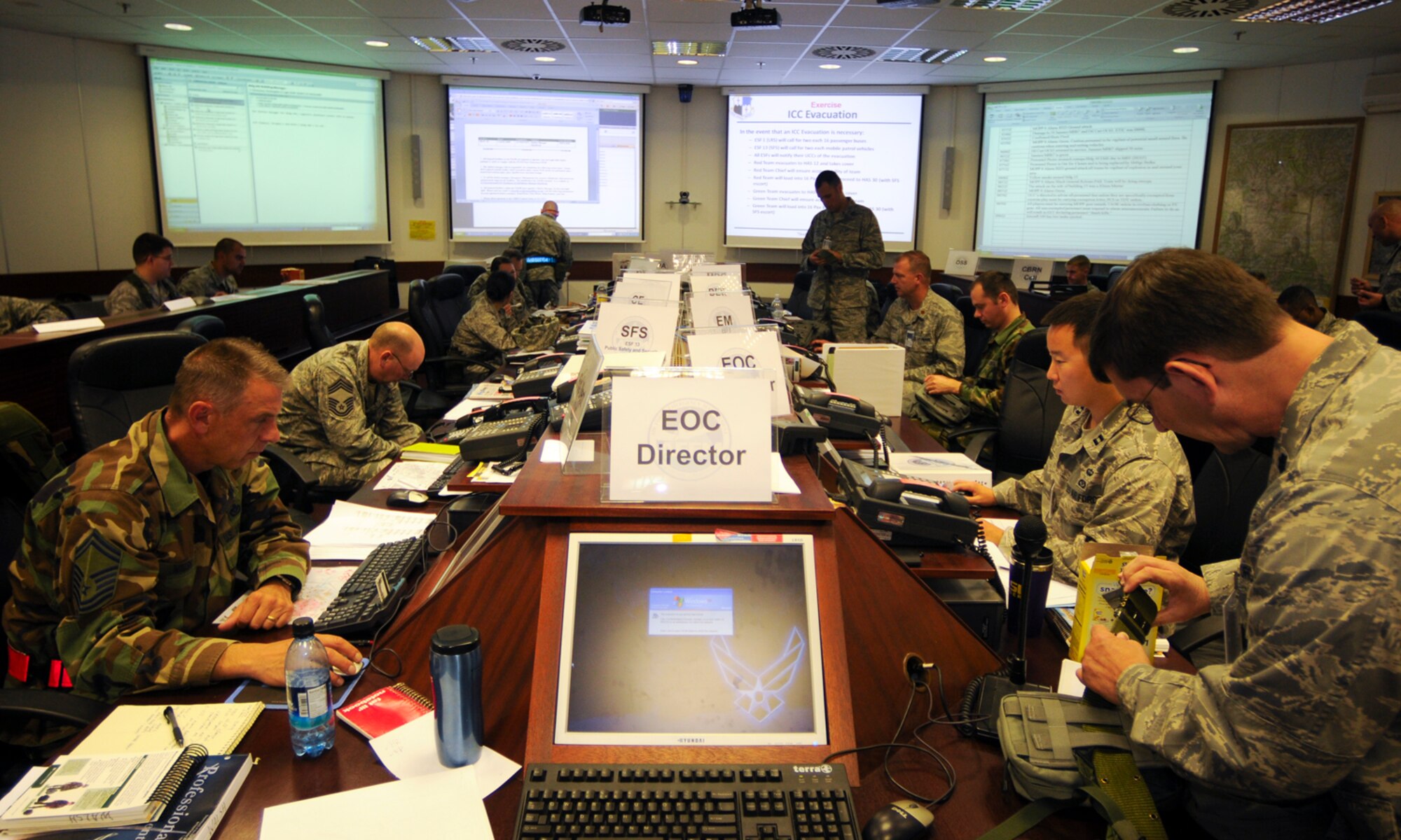 SPANGDAHLEM AIR BASE, Germany -- Members of the 52nd Fighter Wing’s Emergency Operations Center provide command and control duties for the 52nd Fighter Wing during the Phase II exercise Aug. 4. The EOC is responsible for managing emergencies and disasters at a strategic level. The EOC ensures that the 52nd Fighter Wing maintains operations during emergencies. (U.S. Air Force photo/Airman 1st Class Nathanael Callon)