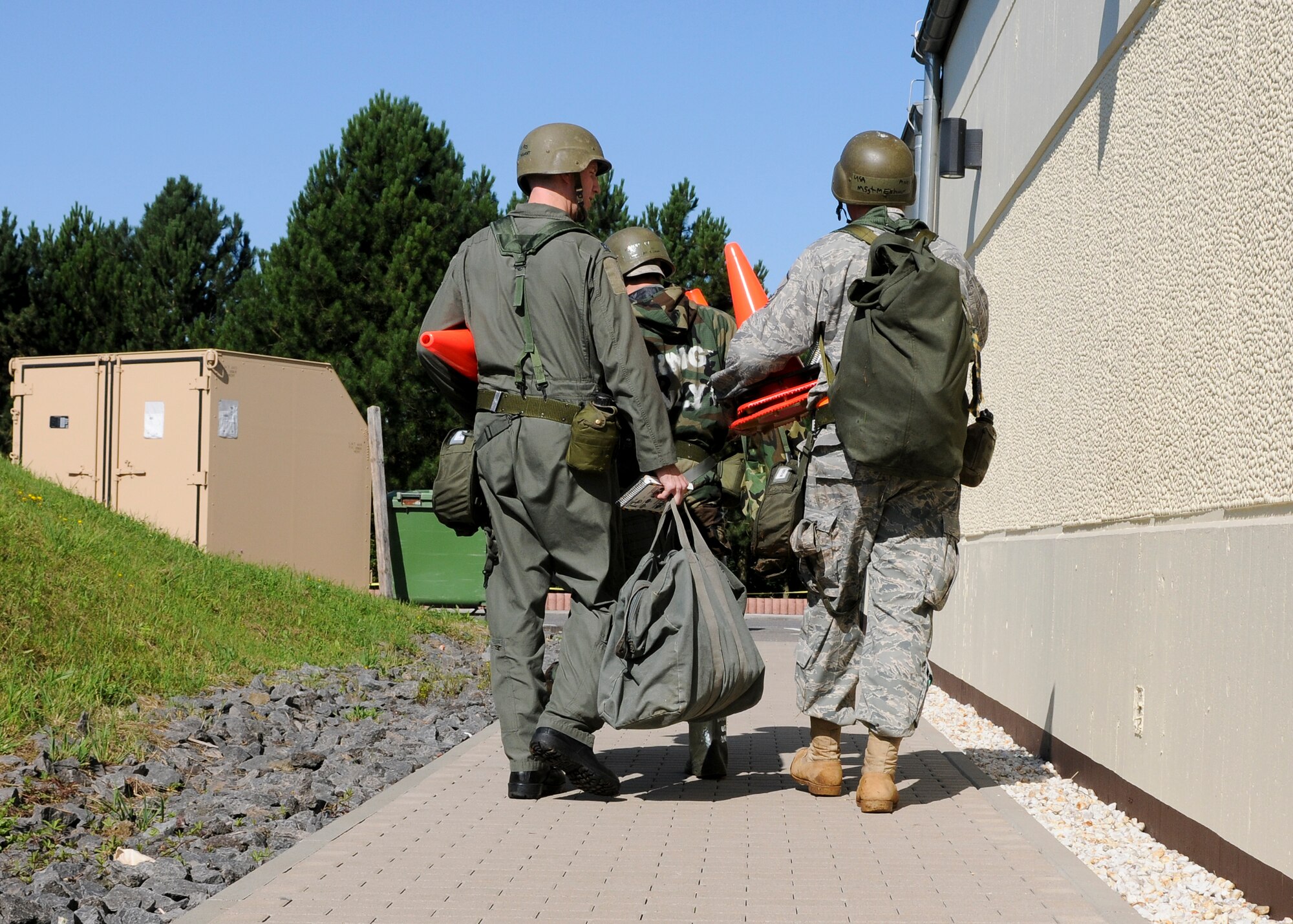 SPANGDAHLEM AIR BASE, Germany -- Members of the 81st Fighter Squadron perform a post attack reconnaissance sweep around the perimeter of a building during the Phase II exercise Aug. 4. The exercise tested the 52nd Fighter Wing’s ability to operate under conventional, and chemical, biological, radiological or nuclear attacks. (U.S. Air Force photo/Airman 1st Class Nathanael Callon)
