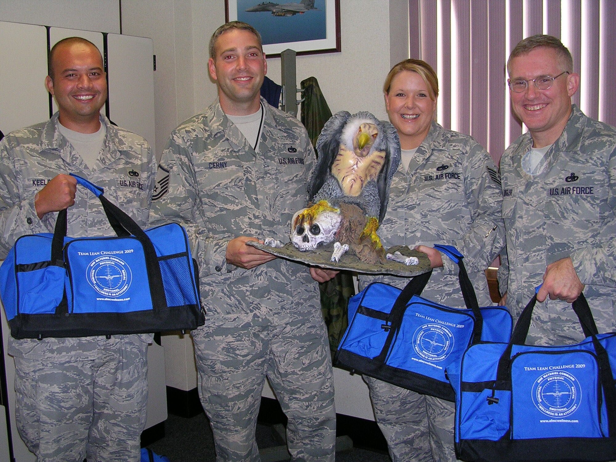 The first-place team in this year's Team Lean Challenge was Team ?Buzzards? from the 46th Maintenance Group.  Pictured L-R are Tech Sgt. Brian Keels, overall weight loss winner Master Sgt. James Cerny, Tech Sgt. Bridget Baxley Chief Master Sgt. Steven Ziegler. Not pictured:  MSgt Kevin Williams (courtsey photo)
          