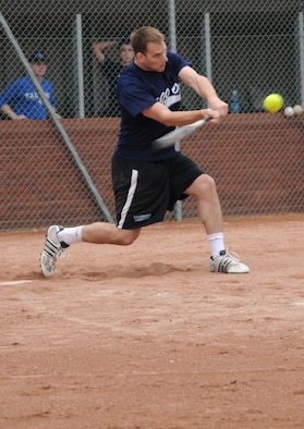 RAF MILDENHALL, England -- Billy Kemper, 100th Operations Group player, takes a swing during the Mildenhall Intramural Softball Championship Aug. 4. The 100th OG took the championship title after a two-game run against the combined 95th Reconissance Squadron and 488th Intelligence Squadron team, winning the first game 6-5 and the second in a 19-2 blowout. (U.S. Air Force photo by Senior Airman Thomas Trower) 