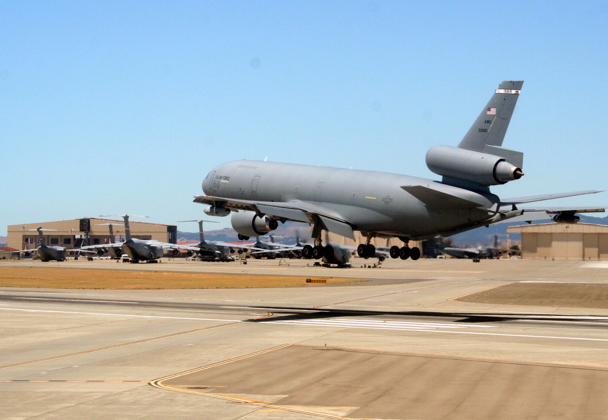 A KC-10 Extender comes in for a landing on the flightline at Travis Air Force Base, Calif., on Aug. 4, 2009.  The KC-10 is one of Air Force's and Air Mobility Command's air refueling aircraft that helps provide global reach and the Air Force to fly, fight and win...in air, space and cyberspace.  (U.S. Air Force Photo/Tech. Sgt. Scott T. Sturkol)