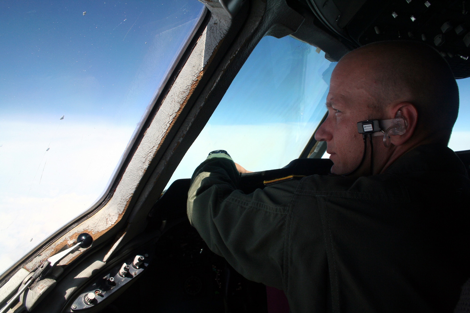 Maj. Jay Johnson, a KC-10 Extender pilot from the 571st Global Mobility Readiness Squadron at Travis Air Force Base, Calif., flies a KC-10 back to California from Scott Air Force Base, Ill., on Aug. 4, 2009.  The KC-10 is one of Air Force's and Air Mobility Command's air refueling aircraft that helps provide global reach and the Air Force to fly, fight and win...in air, space and cyberspace.  (U.S. Air Force Photo/Tech. Sgt. Scott T. Sturkol)