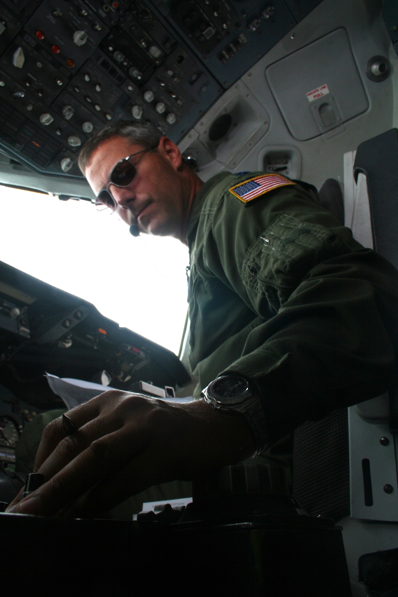 Lt. Col. Chad Johnson, a KC-10 Extender pilot from the 9th Air Refueling Squadron at Travis Air Force Base, Calif., flies a KC-10 back to California from Scott Air Force Base, Ill., on Aug. 4, 2009.  The KC-10 is one of Air Force's and Air Mobility Command's air refueling aircraft that helps provide global reach and the Air Force to fly, fight and win...in air, space and cyberspace.  (U.S. Air Force Photo/Tech. Sgt. Scott T. Sturkol)