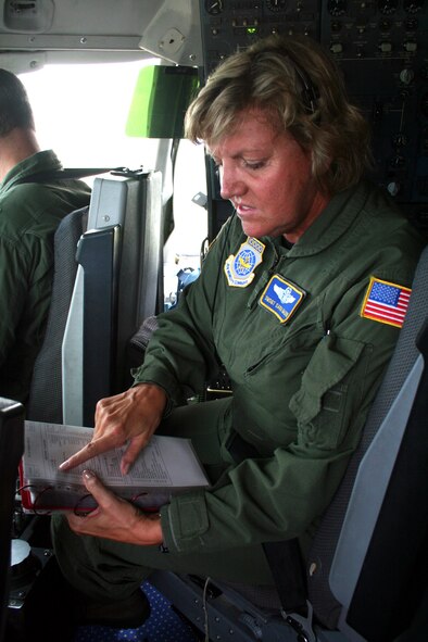 Senior Master Sgt. Sara Galvin, a KC-10 Extender flight engineer from the 9th Air Refueling Squadron at Travis Air Force Base, Calif., prepares a KC-10 for a flight back to California while stopped at Scott Air Force Base, Ill., on Aug. 4, 2009.  The KC-10 is one of Air Force's and Air Mobility Command's air refueling aircraft that helps provide global reach and the Air Force to fly, fight and win...in air, space and cyberspace.  Sergeant Galvin has more than 10,000 flying hours as a flight engineer. (U.S. Air Force Photo/Tech. Sgt. Scott T. Sturkol)