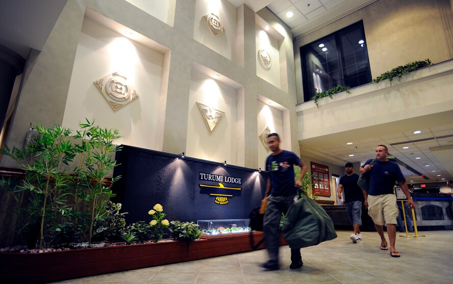 Guests head to their rooms after checking into Turumi Lodge, Osan Air Base, Republic of Korea, Aug. 4. Voted the best lodging facility in the Pacific Air Force's for 2009, Turumi Lodge will now compete for the most prestigious lodging award in the Air Force: the Innkeeper award. The Air Force Innkeeper award is presented annually to recognize the lodging operation that provides the most outstanding hotel-type lodging and customer service to Air Force travelers. (U.S. Air Force photo/Staff Sgt. Brian Ferguson)