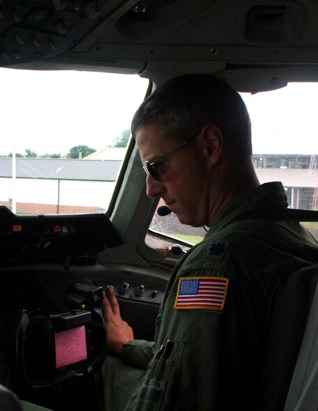 Lt. Col. Chad Johnson, a KC-10 Extender pilot from the 9th Air Refueling Squadron at Travis Air Force Base, Calif., prepares a KC-10 for a flight back to California while stopped at Scott Air Force Base, Ill., on Aug. 4, 2009.  The KC-10 is one of Air Force's and Air Mobility Command's air refueling aircraft that helps provide global reach and the Air Force to fly, fight and win...in air, space and cyberspace.  (U.S. Air Force Photo/Tech. Sgt. Scott T. Sturkol)