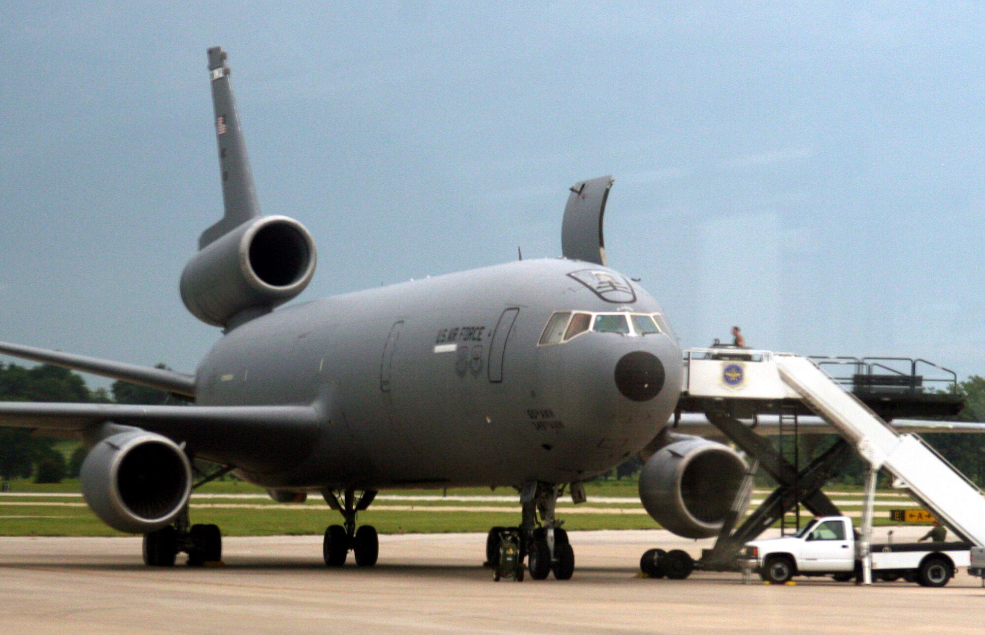 Airmen prepare a KC-10 Extender from the 60th Air Mobility Wing, Travis Air Force Base, Calif., for a flight back to California while stopped at Scott Air Force Base, Ill., on Aug. 4, 2009.  The KC-10 is one of Air Force's and Air Mobility Command's air refueling aircraft that helps provide global reach and the Air Force to fly, fight and win...in air, space and cyberspace.  (U.S. Air Force Photo/Tech. Sgt. Scott T. Sturkol)