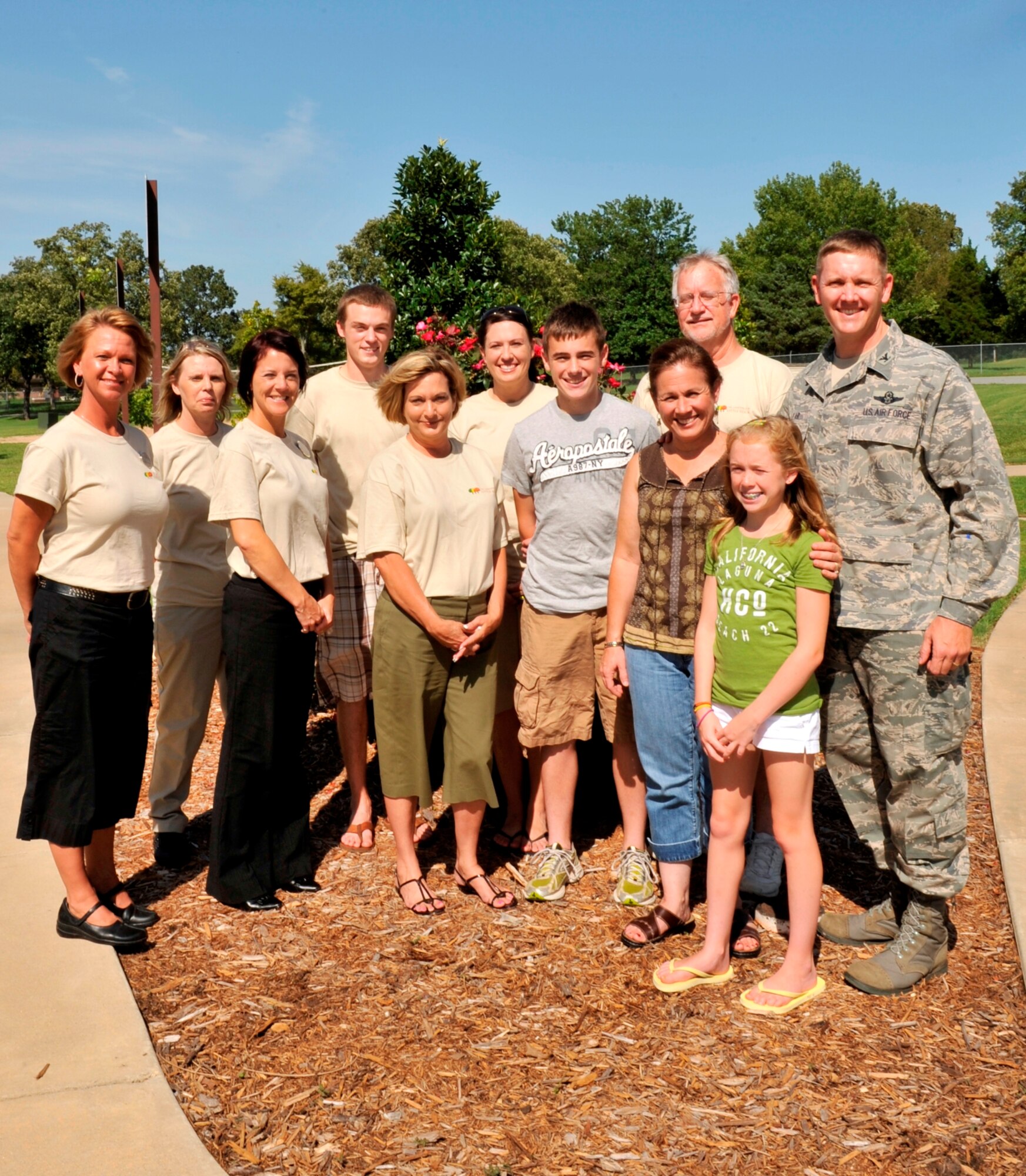 Col. Kirk Lear (right), 314th Airlift Wing vice commander, and his family meet with The Landings at Little Rock staff who were instrumental during their arrival here August 7, 2009. Colonel Lear is accompanied by his wife, Susan, daughter, Reagan and son, Trevor.