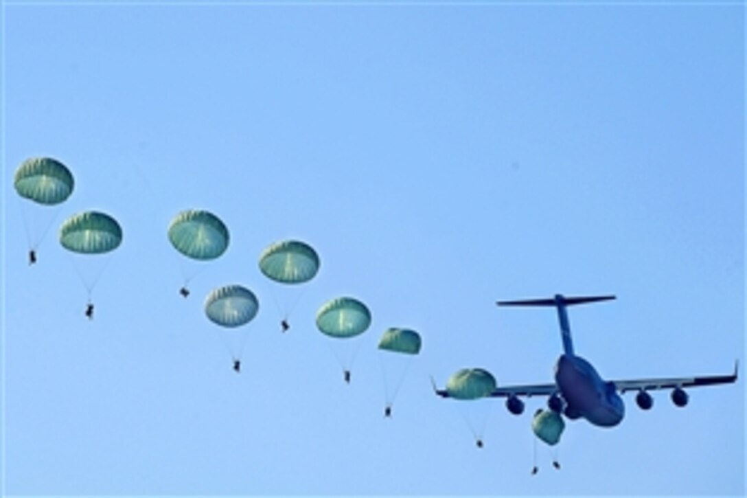 U.S. Army Rangers parachute from a U.S. Air Force C-17 Globemaster III during Ranger Rendezvous over Fryar Drop Zone on Fort Benning, Ga., Aug. 3, 2009. More than 1,000 Rangers assigned to four Ranger battalions from across the country participated in a mass tactical airborne operation.