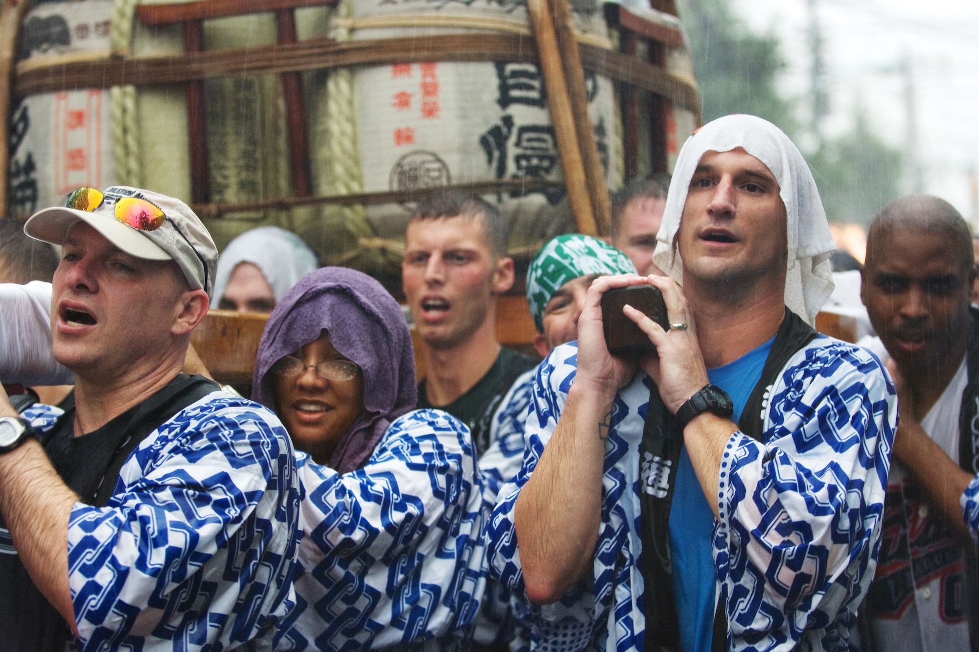 FUSSA, Japan – Airmen from Yokota Air Base carry a portable Shinto shrine during the 59th Annual Fussa Tanabata Festival Aug. 7. The shrine, called a Mikoshi, translates as “cloud burst” in English. More than 40 Airmen carry the shrine each year during the festival, also known as the “star festival.” According to Chinese legend, the two stars Altair and Vega, usually separated from each other by the Milky Way galaxy, meet up in the night sky on the same day each year. (U.S. Air Force photo/Osakabe Yasuo)