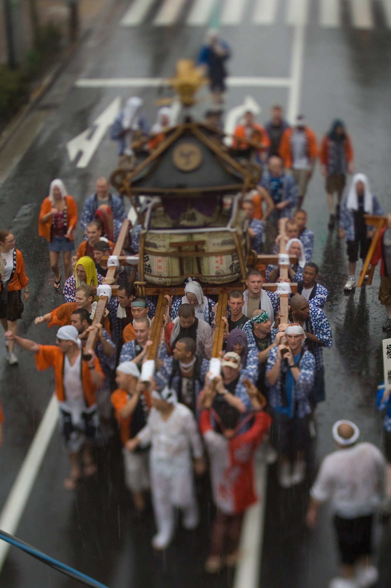 FUSSA, Japan – Airmen from Yokota Air Base carry a portable Shinto shrine during the 59th Annual Fussa Tanabata Festival Aug. 7. The shrine, called a Mikoshi, translates as “cloud burst” in English. More than 40 Airmen carry the shrine each year during the festival, also known as the “star festival.” According to Chinese legend, the two stars Altair and Vega, usually separated from each other by the Milky Way galaxy, meet up in the night sky on the same day each year. (U.S. Air Force photo/Osakabe Yasuo)
