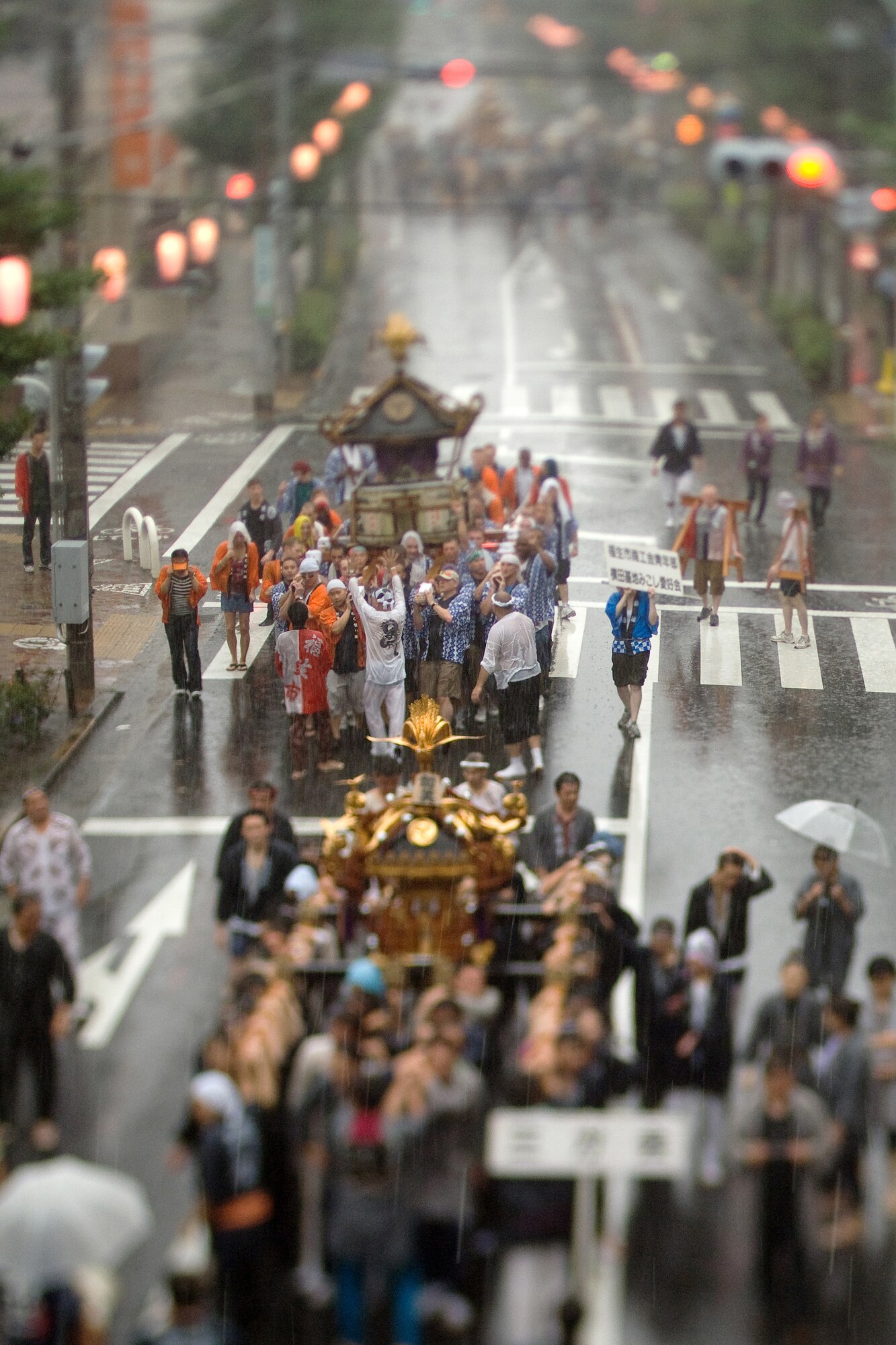 FUSSA, Japan – Airmen from Yokota Air Base carry a portable Shinto shrine during the 59th Annual Fussa Tanabata Festival Aug. 7. The shrine, called a Mikoshi, translates as “cloud burst” in English. More than 40 Airmen carry the shrine each year during the festival, also known as the “star festival.” According to Chinese legend, the two stars Altair and Vega, usually separated from each other by the Milky Way galaxy, meet up in the night sky on the same day each year. (U.S. Air Force photo/Osakabe Yasuo)
