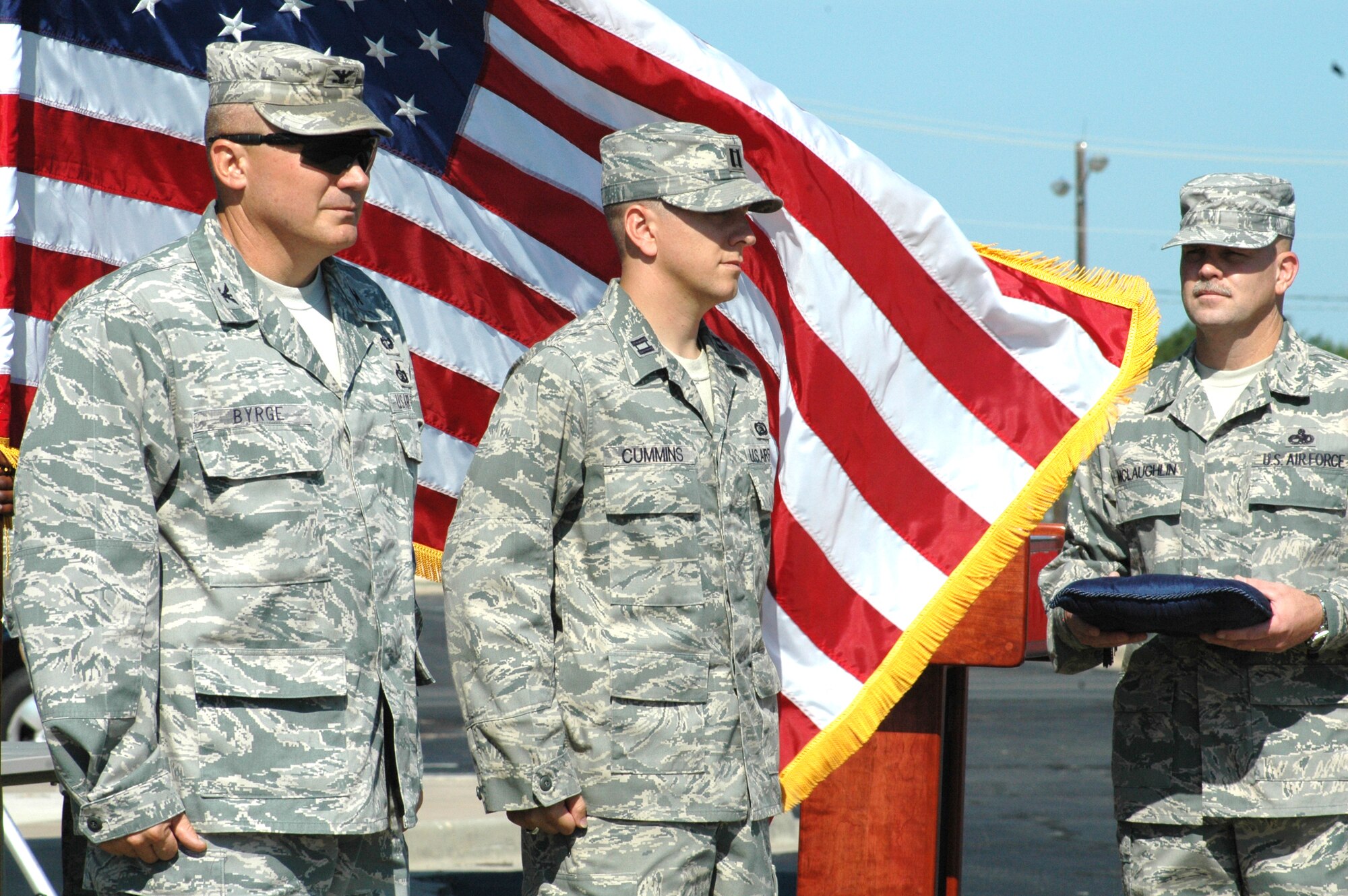 During a ceremony attended by his wife, son and fellow Airmen in the 3rd Combat Communications Group, Capt. Shannon Cummins, center, received the Bronze Star recently. The Bronze Star was presented for his actions while deployed with a Joint Task Force, where he was responsible “to plan, manage and ensure effective communications during sustained combat operations.” (Photo by Micah Garbarino)