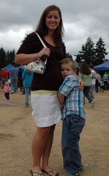 Charity Allen, left, enjoys the day with 5-year-old John Fowler at the 446th Airlift Wing annual Family Day celebrations, on Aug. 8 at Heritage Hill, McChord Air Force Base, Wash. John and Allen are the son and girlfriend respectively of Tech. Sgt Jason Fowler, 446th Aircraft Maintenance Squadron.  (U.S. Air Force photo/ Tech. Sgt. Jake Chappelle). 