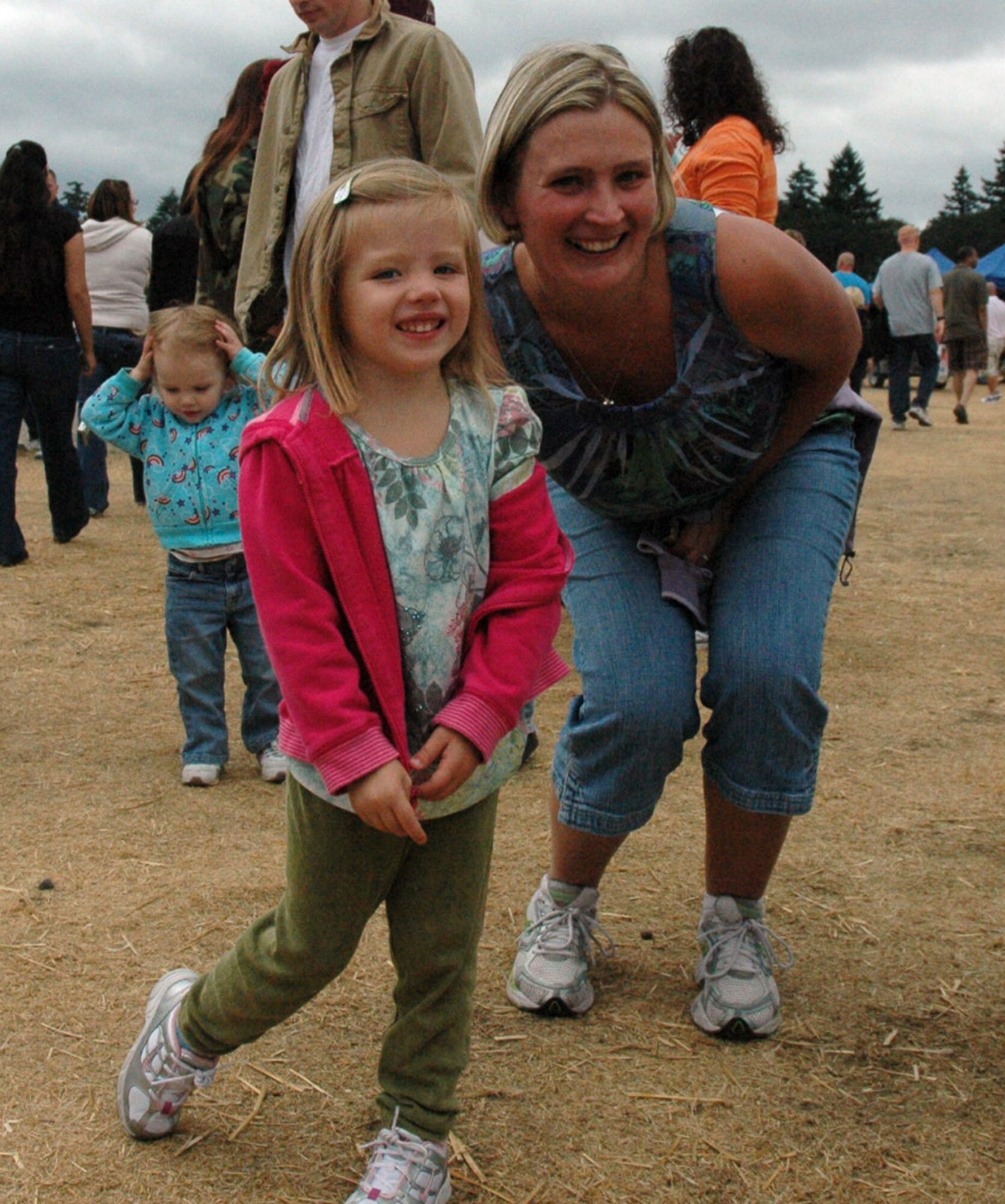 Kennedy Barrow, 3, gets ready to buy treats with her mother, Staff Sgt. Andrea Barrow, 446th Services Flight, at the 446th Airlift Wing annual Family Day, Aug. 8, at Heritage Hill, McChord Air Force Base, Wash. The event celebrated families who support Reservists and the mission. (U.S. Air Force photo/Tech. Sgt. Jake Chappelle).
