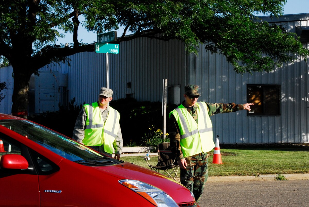 SIOUX FALLS, S.D. -- Security augmentees, Staff Sgt. Matthew Hendrickson, 114th MXS and Staff Sgt. Chris Schuette, 114th CF assist drivers in finding handicap parking. (U.S. Air Force photo by Staff Sgt. Quinton Young)