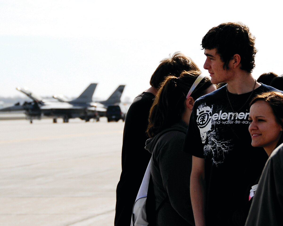 SIOUX FALLS, S.D. -- Taylor Wrighton and Sam Goossen, students at Marion High School, join other Career Day attendees to watch the launching of the F-16 aircraft at Joe Foss Field, SD.  Career Day is an annual event held by the 114th Fighter Wing recruiters to show interested high school students some of the many career opportunities available at the South Dakota Air National Guard.  This years Career Day was held on Apr. 15. (U.S. Air Force Photo by Master Sgt. Nancy Ausland)