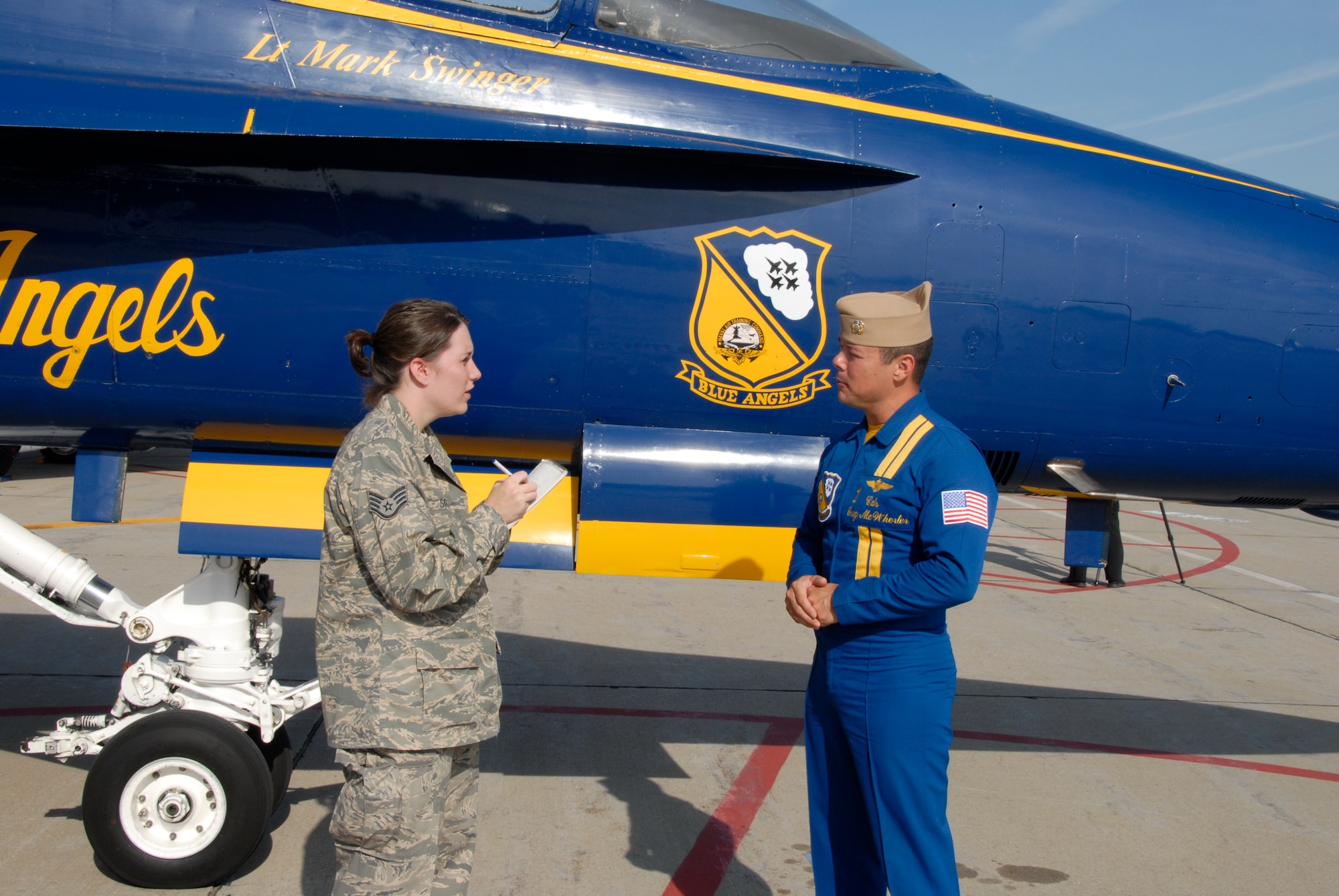 Staff Sgt. Miranda Skiles interviews Cmdr. Greg McWherter, flight leader and commanding officer of the Navy Blue Angels flight demonstration team.
(U.S. Air Force Photo by Master Sgt Chris Stewart)