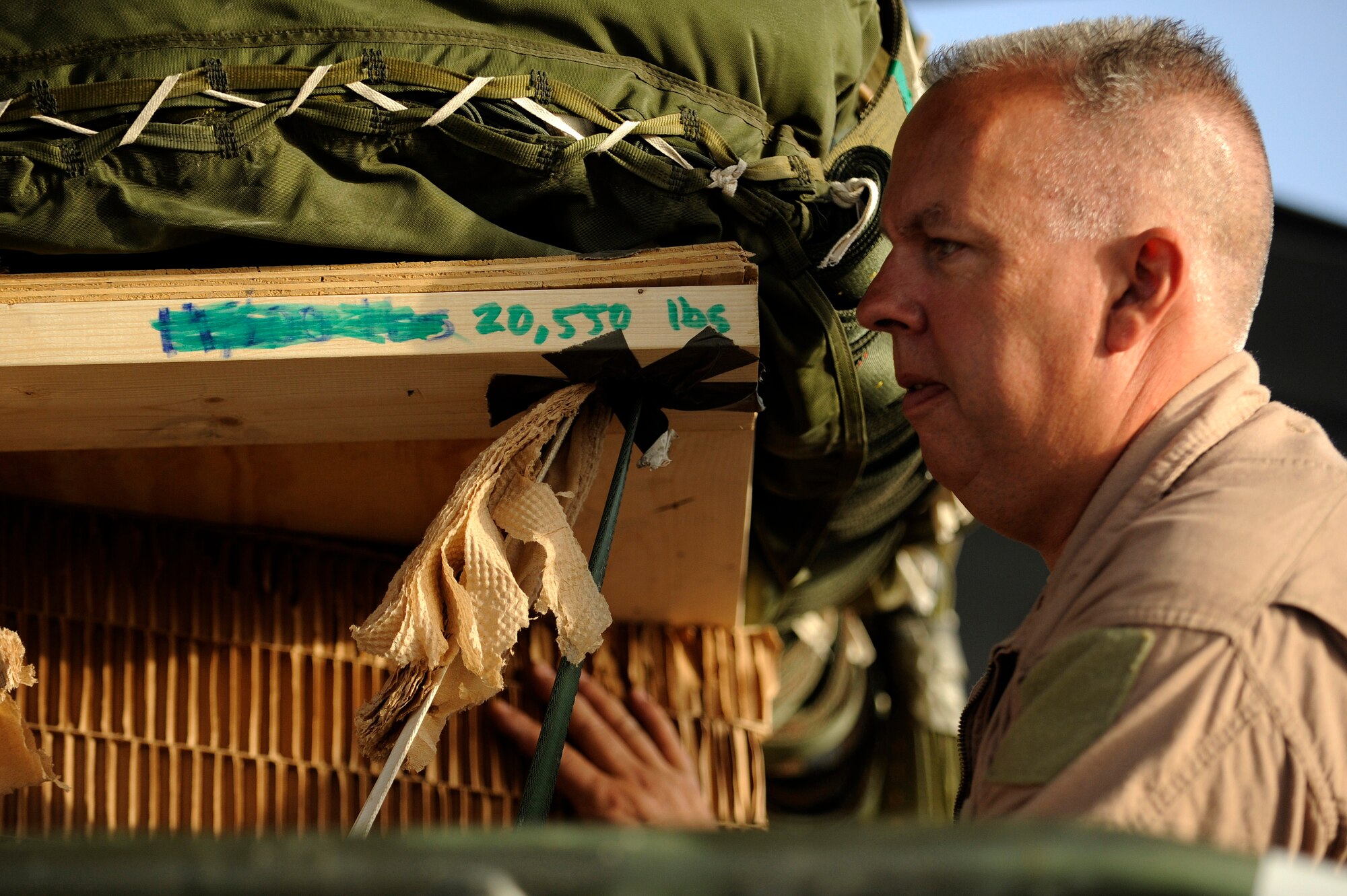 BAGRAM AIRFIELD, Afghanistan - Senior Master Sgt. Kevin Gifford loads a ten-ton pallet aboard a C-130H Hercules aircraft. Sergeant Gifford and the Total Force aicrew from the 774th Expeditionary Airlift Squadron delivered an M198 howitzer artillery piece to a forward operating base in Afghanistan Aug. 8, 2009. The 36-foot long cannon will give troops the ability to send high explosive shells at insurgents threatening the peace and security of the Paktika Province. Sergeant Gifford is a New York Air National Guardsman from Schenectady, N.Y. (U.S. Air Force photo by Staff Sgt. Michael B. Keller)