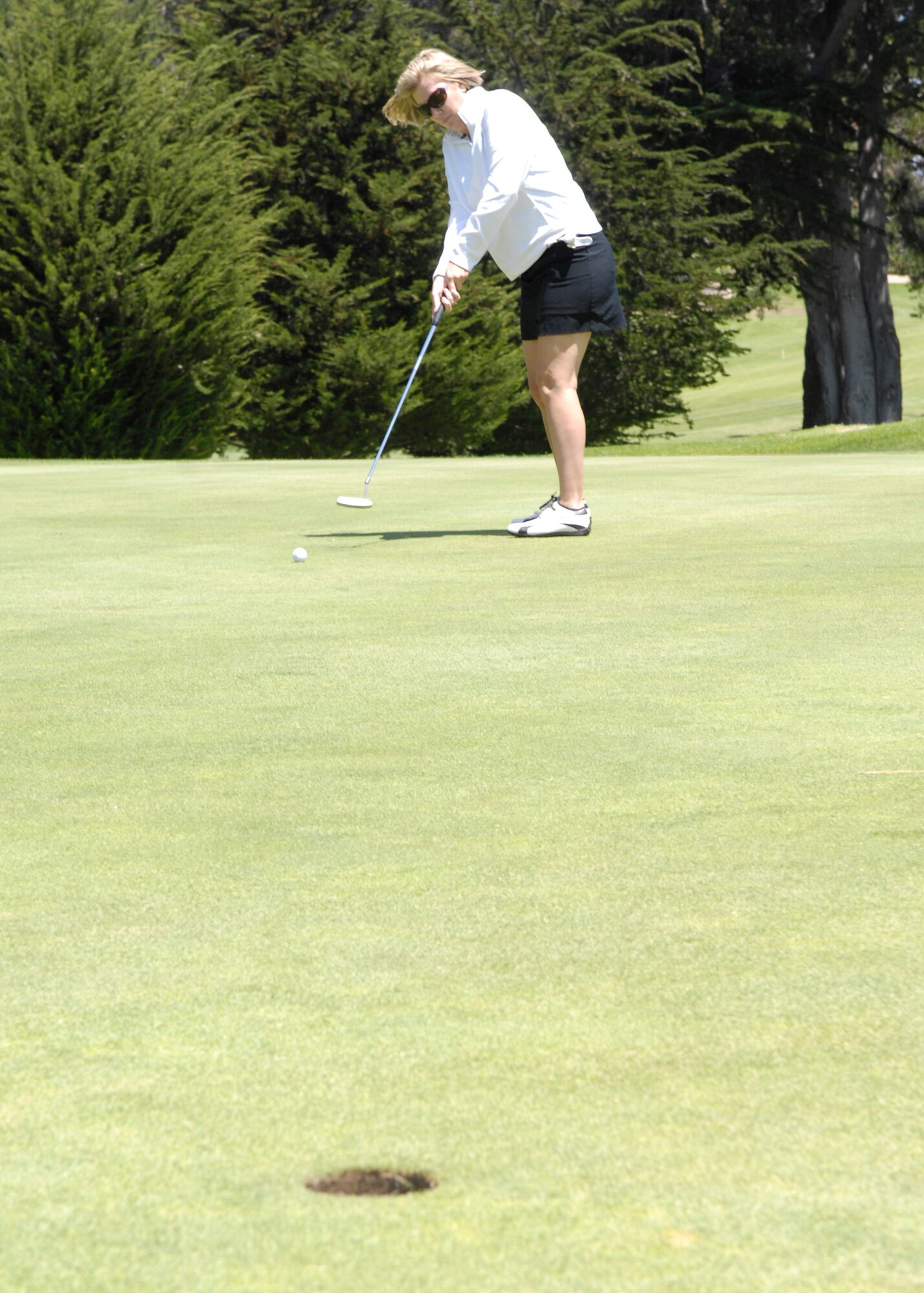 Betsy Watkins attempts a long putt for birdie during the Air Force Association Golf Tournament on Aug. 7 held at the Marshallia Ranch Golf Course (U.S. Air Force photo/ Staff Sgt. Scottie T. McCord)