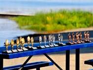 Medical Lake, Wash. – Gold, silver and bronze medallions are awarded to athletes at the end of the Clear Lake Triathlon in Medical Lake, Wash., July 25. (U.S. Air Force photo / Airman 1st Class Melissa L. Carlino)