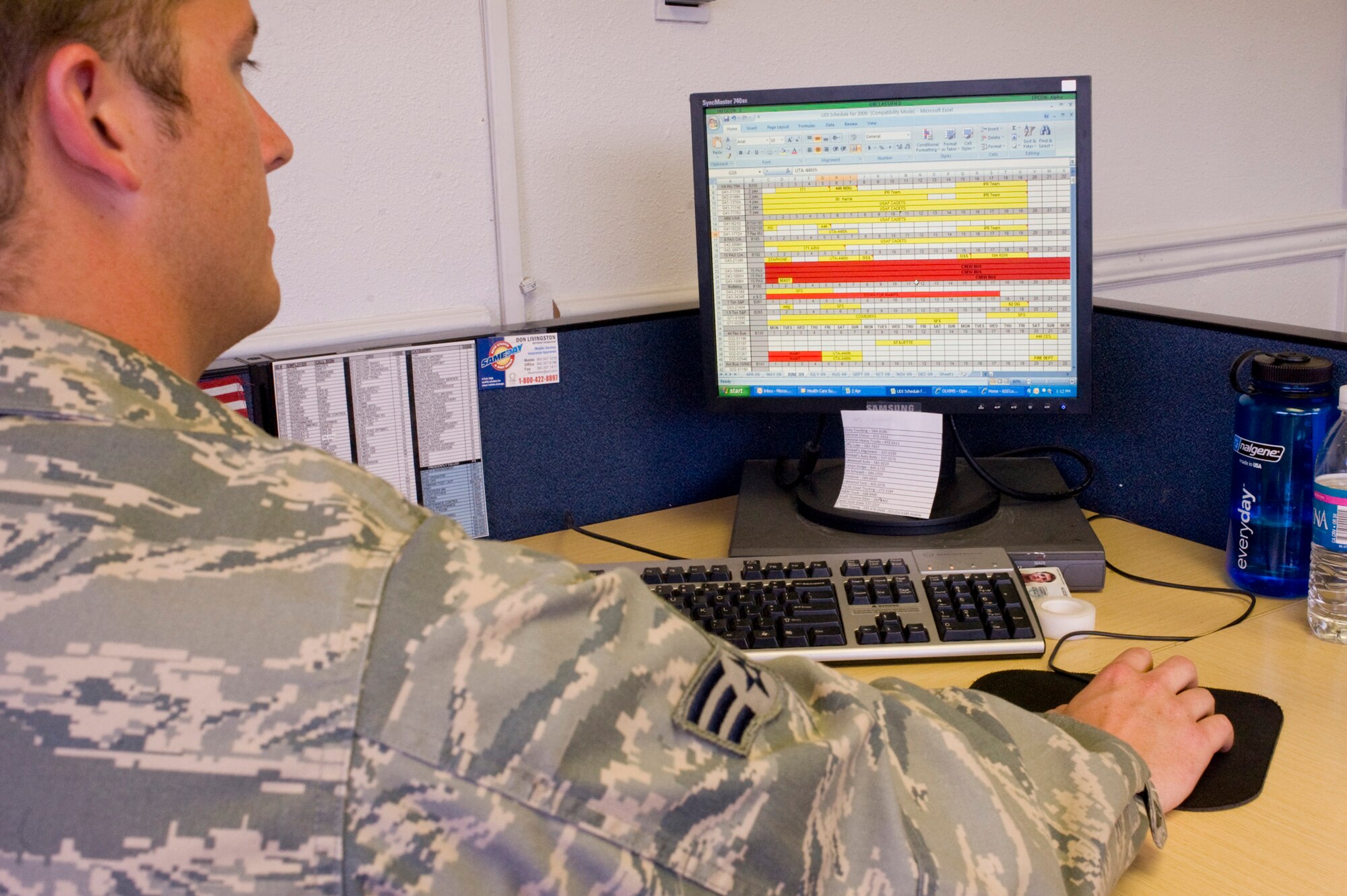 Senior Airman Justin Nolan, 62nd LRS, uses an on-line managing system to research vehicle availability while manning the vehicle operations control center. (U.S. Air Force Photo/Abner Guzman)