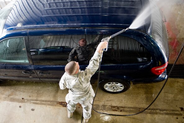 Airman First Class Jermie Ferguson, 62nd LRS, utilizes the LRS 24-hour self-help wash rack to ready a government vehicle for customer use. (U.S. Air Force Photo/Abner Guzman)