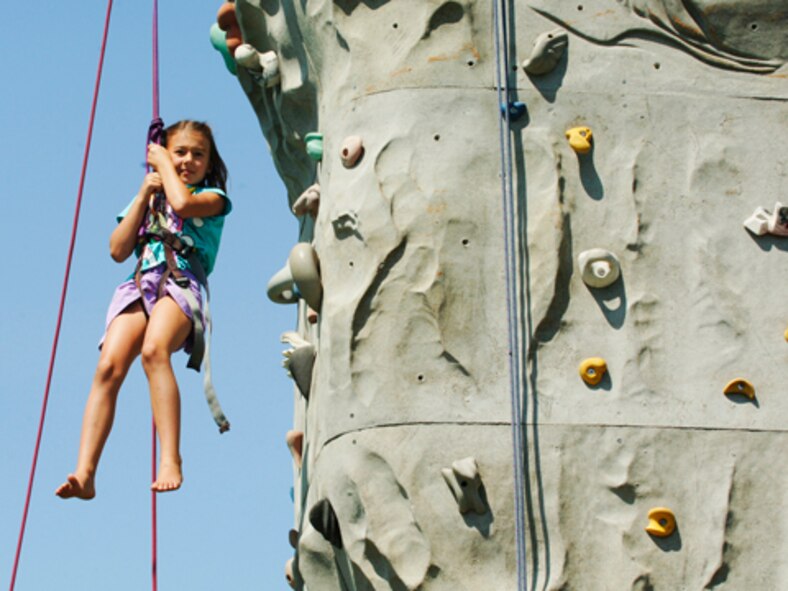 FAIRCHILD AIR FORCE BASE, Wash. –A young girl rappels down from a climbing rock after reaching the top while enjoying the festivities of the Base Picnic at Miller Park here July 30. (U.S. Air Force photo / Senior Airman Joshua K. Chapman)