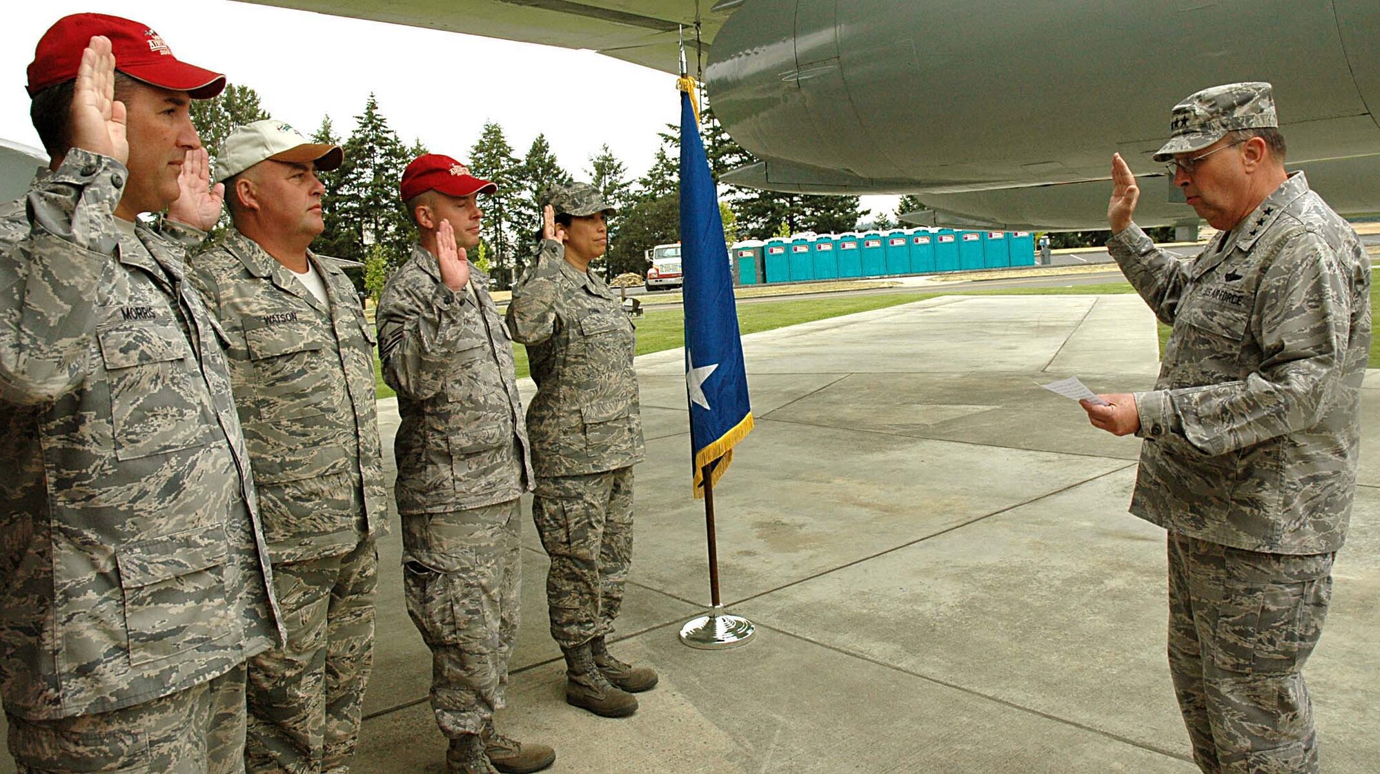 Lt. Gen. Charles Stenner Jr., Air Force Reserve Command commander, reenlists (from left to right) Chief Master Sgt. Daniel Morris and Master Sgt. Adam Harrison both from the 446th Maintenance Operations Flight, Master Sgt. Daniel Watson, 446th Maintenance Squadron, and Staff Sgt. Anayansi Chinn, 446th Mission Support Squadron, during the 2009 Rodeo competition at McChord Air Force Base, Wash., July 24.  The 446th Airlift Wing is the Reserve associate unit at McChord. (U.S. Air Force photo/Airman 1st Class Patrick Cabellon)