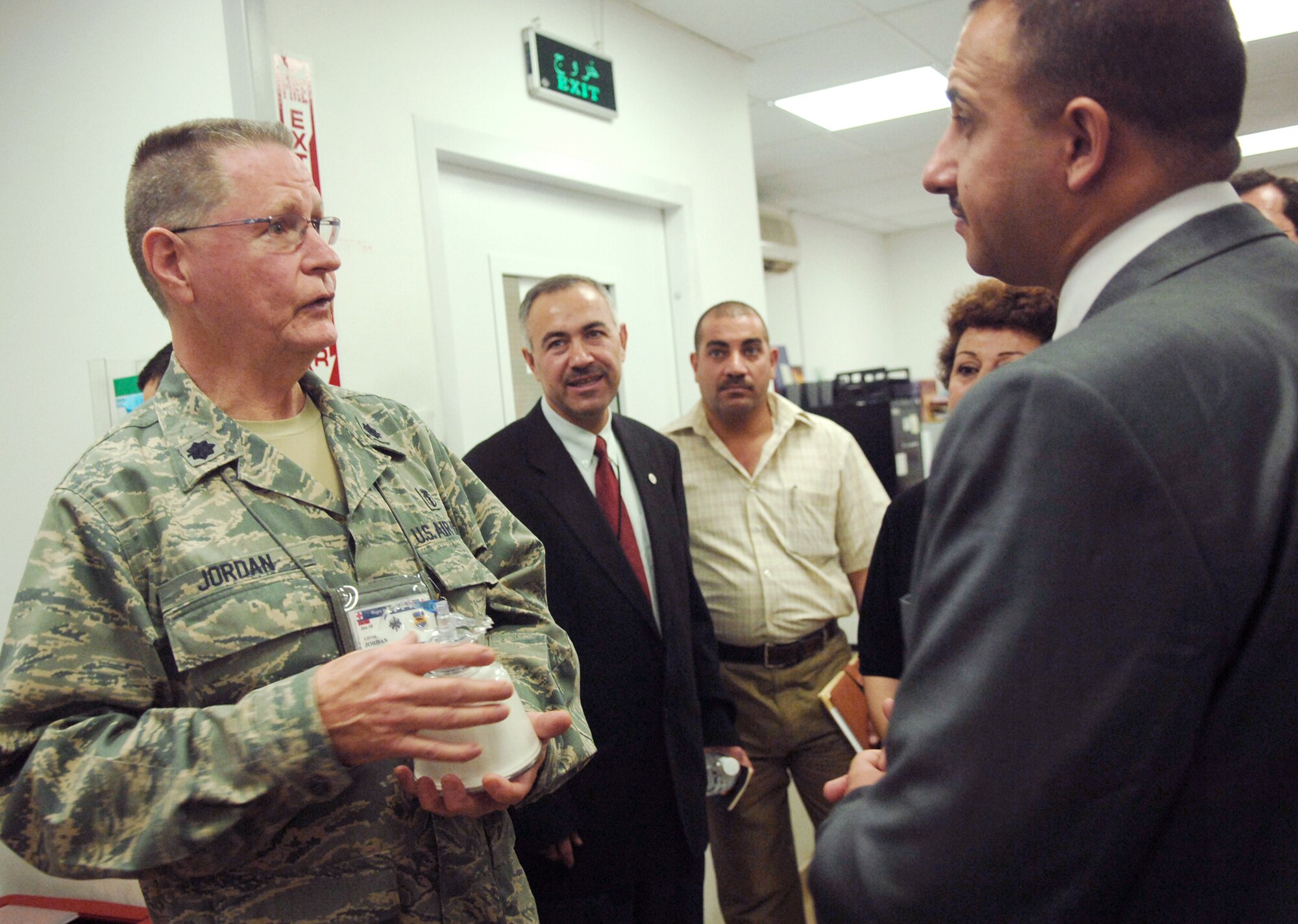 Lt. Col. Thomas Jordan briefs Iraqi Salah Ad Din Province Deputy Governor Ahmed al-Krayem on how blood platelets affect the Air Force Theater Hospital's mission Aug. 5 at Joint Base Balad, Iraq. Colonel Jordan is the 332nd Expeditionary Medical Support Squadron aphaeresis chief. (U.S. Air Force photo/Senior Airman Christopher Hubenthal) 