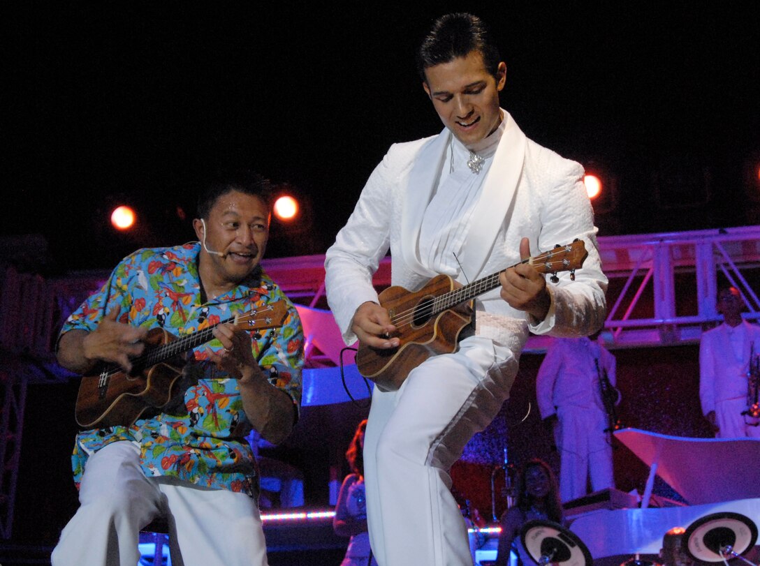 Master Sgt. Herbert Ancog and Senior Airman Johnny Magbanua sing and play the ukulele to “Somewhere over the Rainbow”, by Hawaiian singer Israel Kamakawiwo'ole. The performance included songs from all music genres. (U.S. Air Force photo/ Harry Tonemah)
