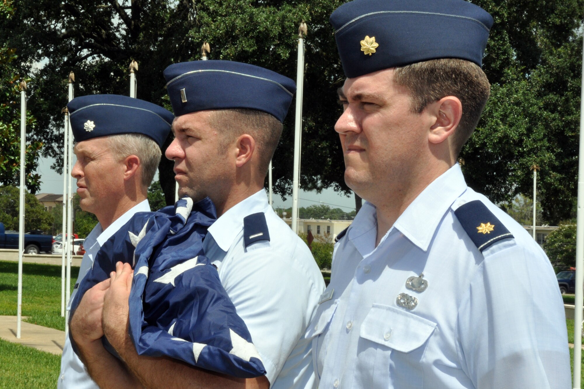 EGLIN AIR FORCE BASE, Fla. – Airmen practice the retreat ceremony procedures Aug. 10 in front of the Air Armament Center headquarters. Every the month this traditional event is hosted by a Team Eglin unit based on a rotating schedule. (U.S. Air Force photos/ Airman Anthony Jennings)  