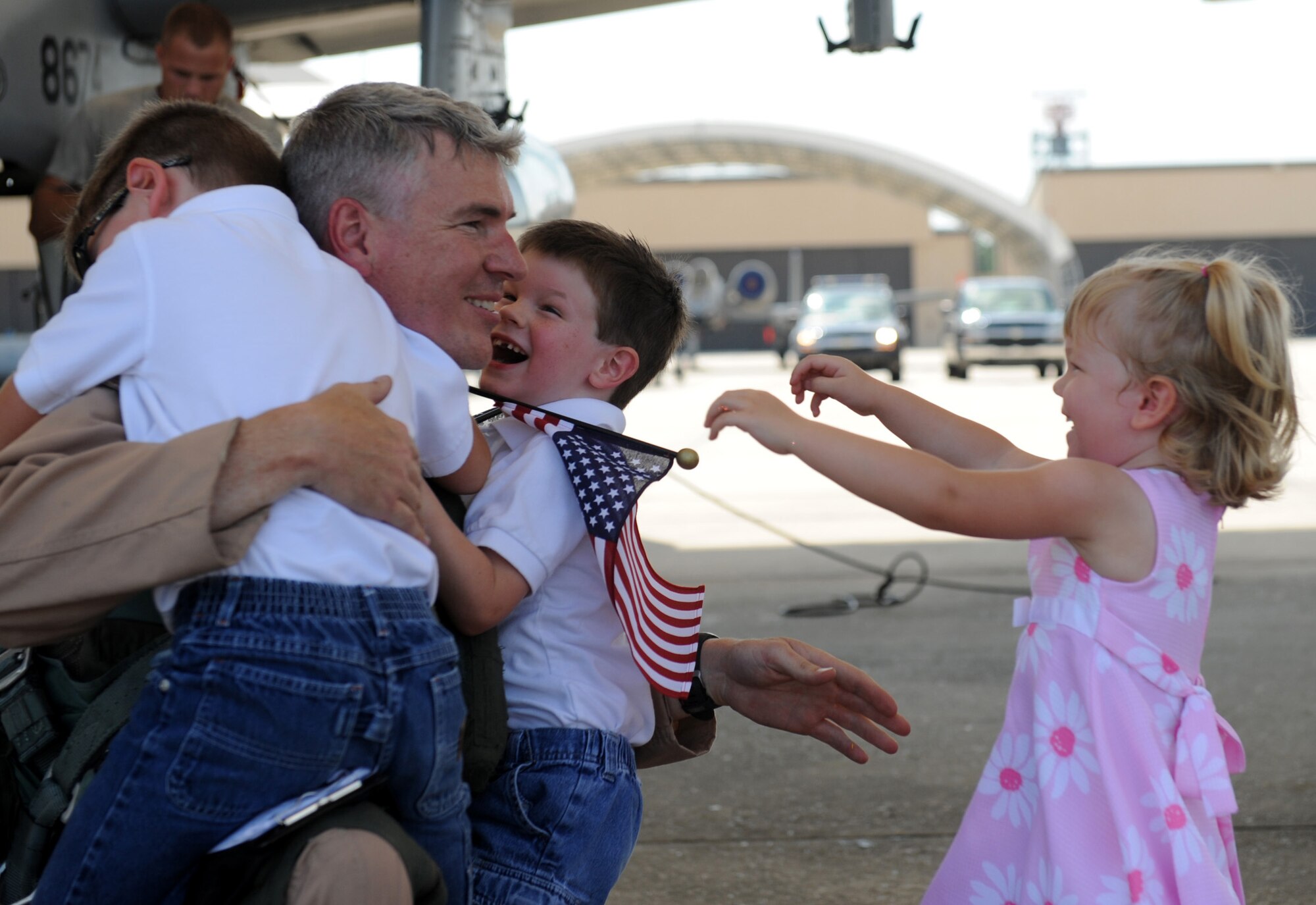 MOODY AIR FORCE BASE, Ga. -- Lt. Col. Philip Wielhouwer, 74th Fighter Squadron commander, is greeted by his children after returning from a deployment here Aug. 9. Colonel Wielhouwer was deployed to Afghanistan in support of Operation Enduring Freedom. (U.S. Air Force photo by Senior Airman Gina Chiaverotti-Paige) 