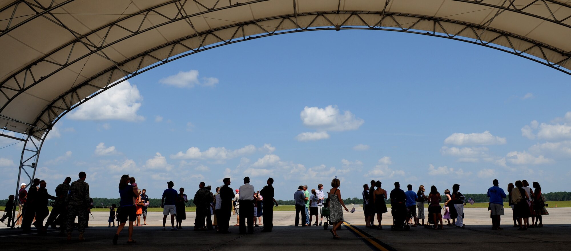 MOODY AIR FORCE BASE, Ga. -- Family members and friends of personnel assigned to the 74th Fighter Squadron wait for their loved ones to return from a deployment here Aug. 9. Ten A-10C Thunderbolt II aircraft also returned from the deployment to Afghanistan. (U.S. Air Force photo by Senior Airman Gina Chiaverotti-Paige) 
