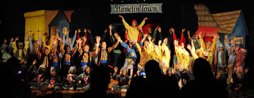 BARKSDALE AIR FORCE BASE, La. -- The cast of the Missoula Children’s Theatre International Tour project perform the finale of the Pied Piper at the Stripes Club, July 31. The MCT is a non-profit organization that tours 1,300 communities in all 50 states, Canada and 14 other countries. (U.S. Air Force photo by Senior Airman Joanna M. Kresge)