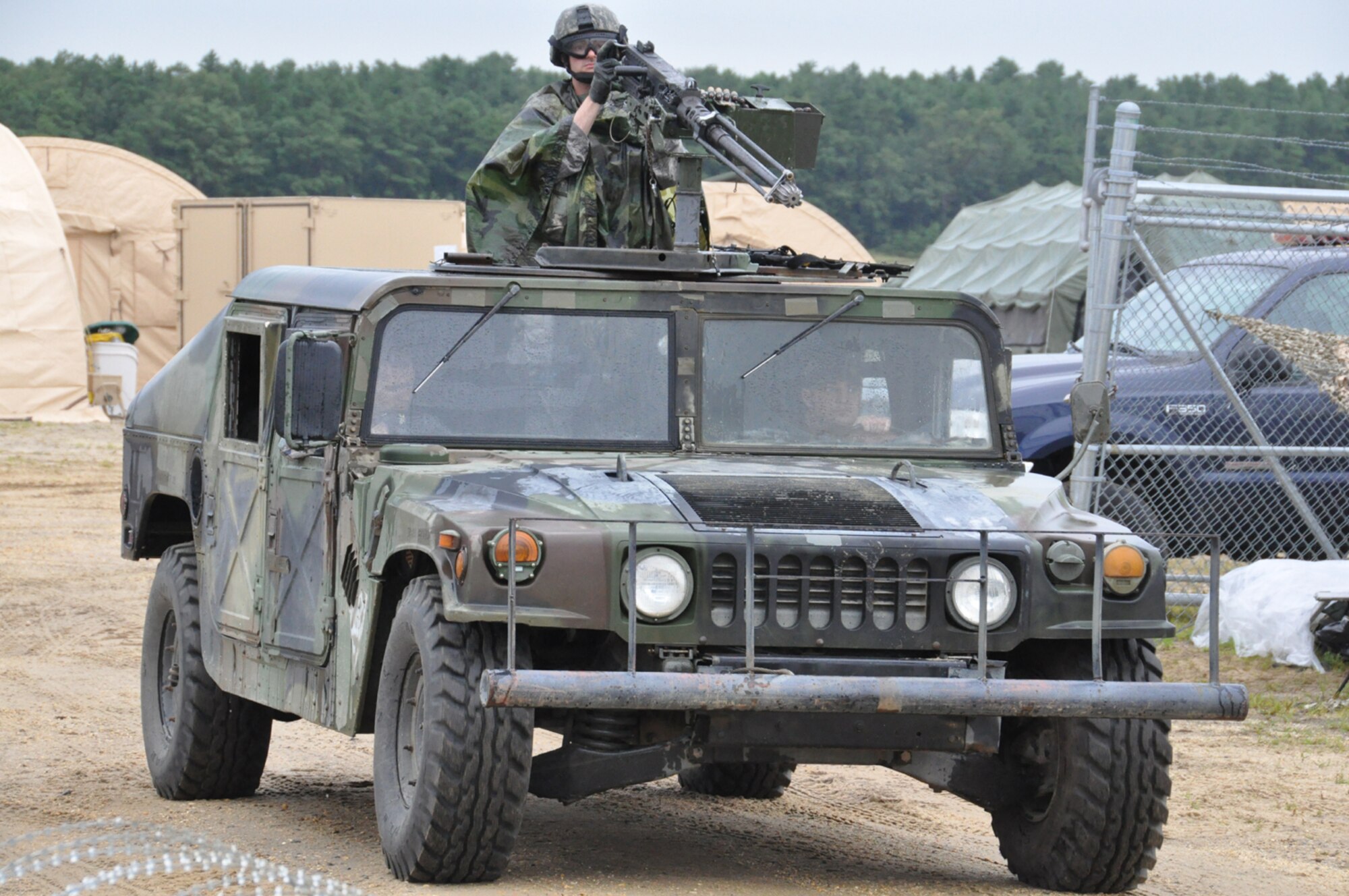 The QRF: Security forces Airmen from 621st Contingency Response Wing respond to a reported incident outside of the main compound during EAGLE FLAG, a joint exercise hosted by the U.S. Air Force Expeditionary Center. For the scenario, the Quick Response Force, or QRF, played a vital role in the security of the 160 Airmen and Soldiers who took part in the humanitarian relief operation following a natural disaster in the ficticious country of Chimera. (U.S. Air Force photo/Capt. Dustin Doyle)
