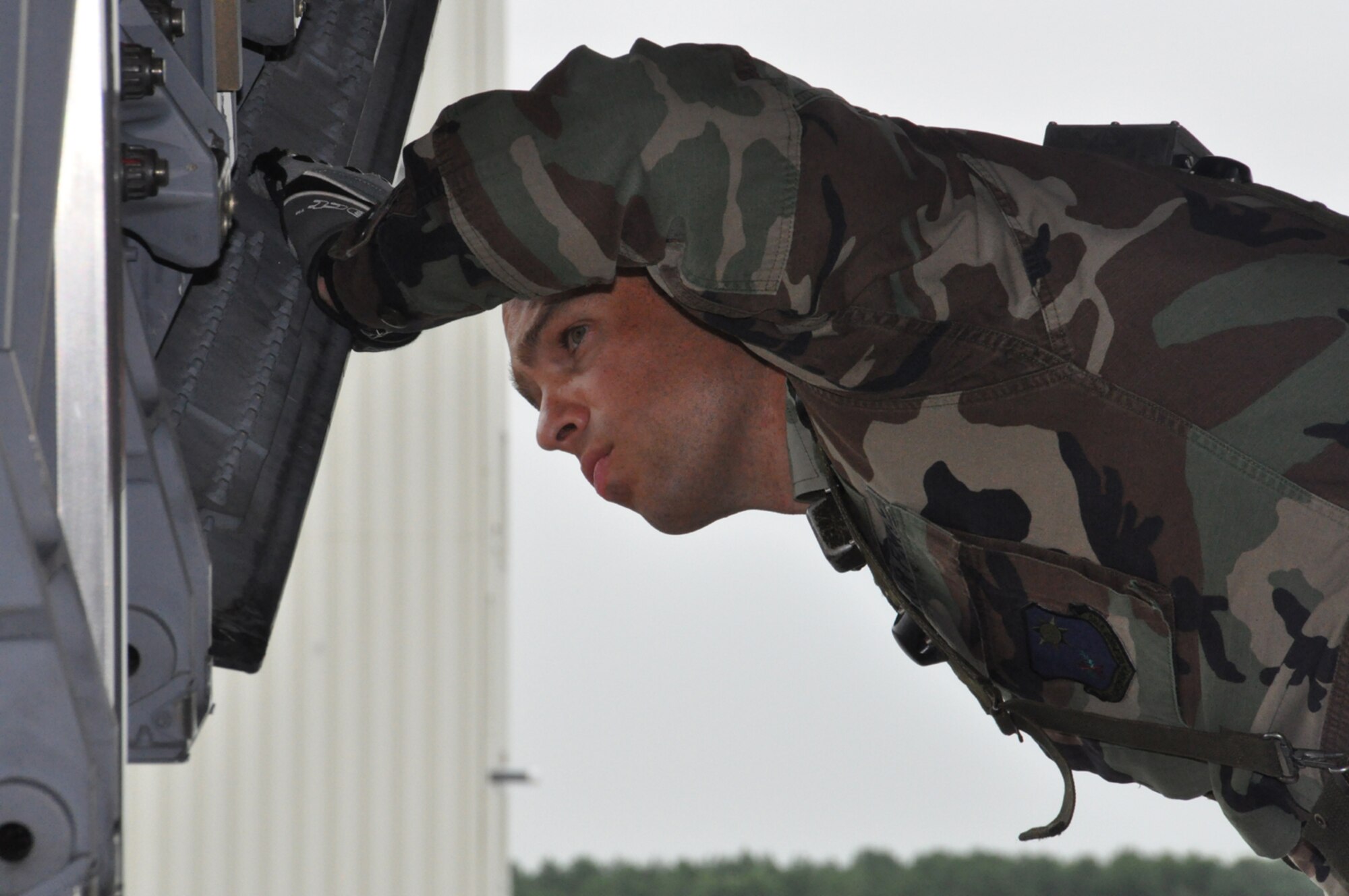 The Workhorse: Staff Sgt. Josh Fleming, an aerial porter with the 817th Contingency Response Group, keeps an eye on cargo being moved from the flightline during EAGLE FLAG, a joint exercise held at Lakehurst Naval Air Engineering Station, Aug. 1-9. Aerial porters formed the backbone of the exercise which focused on the delivery and distribution of supplies and equipment during a humanitarian relief operation to the ficticious country of Chimera. (U.S. Air Force photo/Capt. Dustin Doyle)