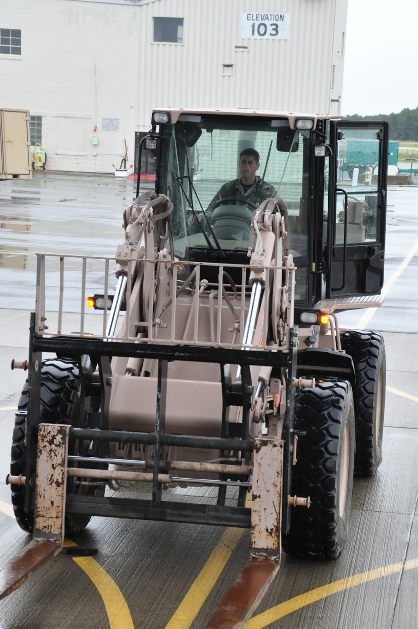 The 10K: Senior Airman Caleb Carmody, an aerial porter with the 817th Contingency Response Wing, prepares to off-load cargo during EAGLE FLAG, a joint exercise held Aug. 1-9 at Lakehurst Naval Air Engineering Station, N.J. Aerial porters from the 621st Contingency Response Wing used 10K forklifts, like the one pictured, to off-load more than 300 pallets from 20 aircraft sorties during the exercise. The cargo was then organized and transported by Soldiers from the Army's 597th Transportation Group to a forward distribution node. (U.S. Air Force photo/Capt. Dustin Doyle)
